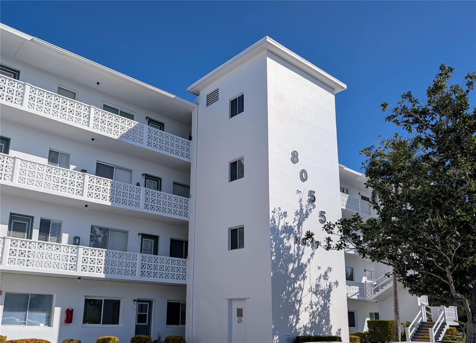 Welcome to easy, resort-style living in this well-maintained 55+ co-op community. This fourth-floor water-view co-op unit offers a comfortable and functional layout featuring a deluxe one-bedroom, one-bath residence with a spacious living room ideal for both relaxing and entertaining.

The bedroom provides direct access to a large private lanai overlooking a serene pond and fountain—an ideal setting to enjoy morning coffee or evening sunsets while observing local wildlife, including ducks and turtles. Walking paths throughout the community wind through beautifully landscaped grounds, enhancing the peaceful, park-like setting.

The co-op community offers distinct benefits to the owners, including very low property tax bills, (just $86.58 in 2025) because the co-op is responsible for the overall property tax bills, which are factored into the monthly HOA maintenance fee.  Seminole Gardens provides an impressive array of amenities designed for active and social living, including individually controlled air conditioning, a heated pool maintained at 85 degrees year-round, the Peacock Center with seating for up to 372, a library with three billiards tables, shuffleboard courts, and two beautiful lakes connected by a canal. Community bus transportation adds convenience, and the location is close to restaurants, shopping, and just minutes from the beach.

Notable updates include a hot water heater replaced in 2021 and an HVAC system installed in 2015. This is an excellent opportunity to enjoy low-maintenance living in a vibrant, well-established 55+ community.