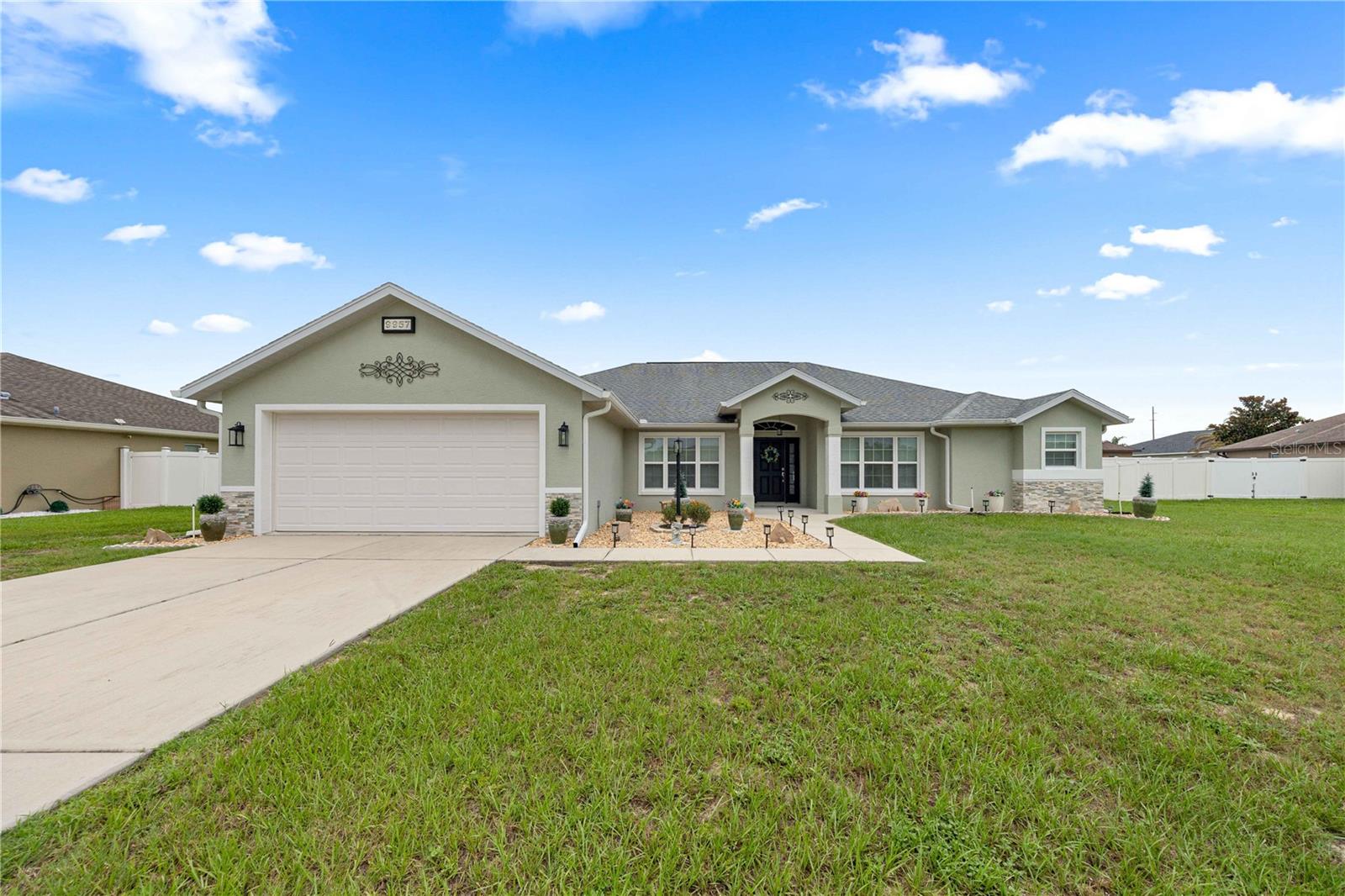 Welcome to 9957 SW 55th Ave Road, Ocala, FL, a beautifully maintained home located on a quiet cul-de-sac in the highly desirable gated community of Meadow Glen in Southwest Ocala. Offering 3 bedrooms, 2 bathrooms, a dedicated office, and 2,150 square feet of thoughtfully designed living space, this stunning Reed Homes Gardenia II model combines quality craftsmanship, modern upgrades, and an unbeatable location just minutes from shopping, restaurants, medical facilities, Interstate 75, and the World Equestrian Center. Situated in a non-flood zone, this move-in-ready home features a spacious split-bedroom floor plan designed for both everyday living and entertaining.

From the moment you arrive, you’ll appreciate the fresh exterior paint, professionally landscaped yard, gutters, and PVC privacy fencing that enhance the home’s exceptional curb appeal. Inside, the open-concept design is highlighted by 6-inch baseboards, abundant natural light, brand-new carpet with premium padding, and a spacious office that’s perfect for working from home, a hobby room, or additional flex space. The gourmet kitchen is sure to impress with granite countertops, 42-inch Aristokraft cabinetry with convenient pull-out drawers, a large pantry, and new stainless steel appliances, creating the ideal space for preparing meals and gathering with family and friends.

The spacious primary suite offers a private retreat featuring elegant tray ceilings, dual walk-in closets, dual vanities, a relaxing jetted soaking tub, and a separate walk-in shower. The oversized laundry room is thoughtfully designed with built-in washer and dryer risers, extensive cabinetry for storage, and a deep utility sink, adding both convenience and functionality. Step outside to the screened lanai with beautiful tile flooring, where you can enjoy Florida’s year-round sunshine in comfort and privacy.

Homes in Meadow Glen are highly sought after for their gated entrance, peaceful streets, and convenient Southwest Ocala location close to parks, golf courses, shopping, dining, hospitals, and some of Central Florida’s top attractions. With quality upgrades throughout, pride of ownership evident in every room, and some furnishings available for purchase, 9957 SW 55th Ave Road presents a rare opportunity to own a meticulously cared-for home on a private cul-de-sac in one of Ocala’s most desirable communities. Schedule your private showing today and discover why so many buyers are searching for homes in Southwest Ocala, Florida.