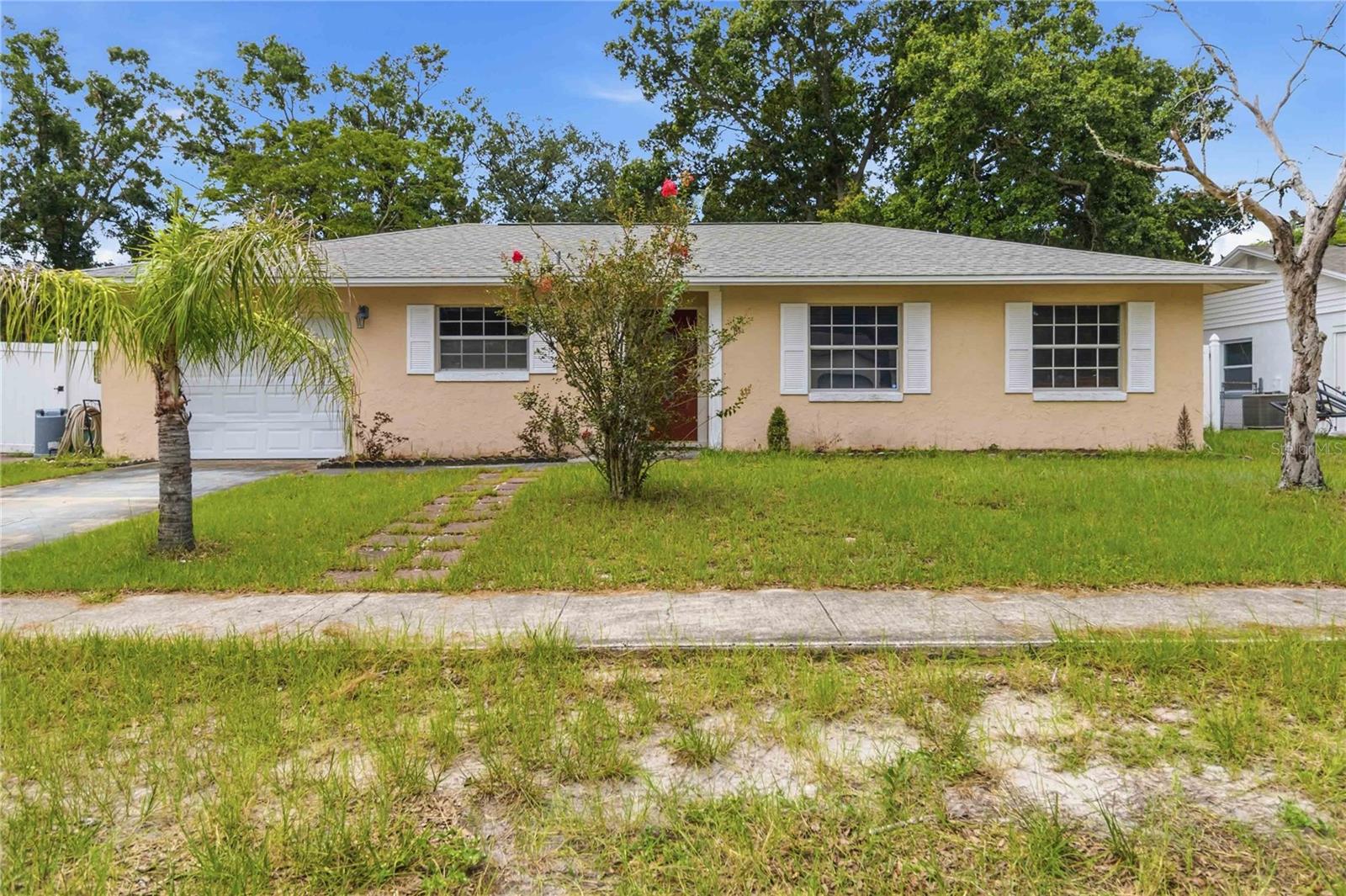 Welcome to this hidden gem in the heart of Casselberry! This charming 4-bedroom, 3-bathroom home offers a versatile layout designed for comfortable living. The private fourth bedroom features its own full bathroom, making it an ideal in-law suite, guest retreat, or private home office. The kitchen is equipped with beautiful granite countertops and provides a functional space for preparing meals and entertaining family and friends. Enjoy the added benefit of fully paid-off solar panels, helping reduce energy costs while increasing efficiency. Step outside to a spacious backyard with plenty of room for gardening, pets, play, or future outdoor entertaining. The covered back porch is the perfect place to unwind after a long day, enjoy your morning coffee, or relax on peaceful Florida evenings. Located in a desirable area with no HOA, this home offers the freedom and flexibility many buyers are looking for. Outdoor enthusiasts will appreciate being within walking distance of several Casselberry parks, including the popular skate park, playgrounds, walking trails, and recreational facilities. Conveniently situated just minutes from shopping centers, restaurants, schools, and major roadways, this home combines a quiet neighborhood feel with easy access to everything Central Florida has to offer. Don't miss this wonderful opportunity to own a move-in-ready home in one of Casselberry's most convenient locations. Schedule your private showing today!