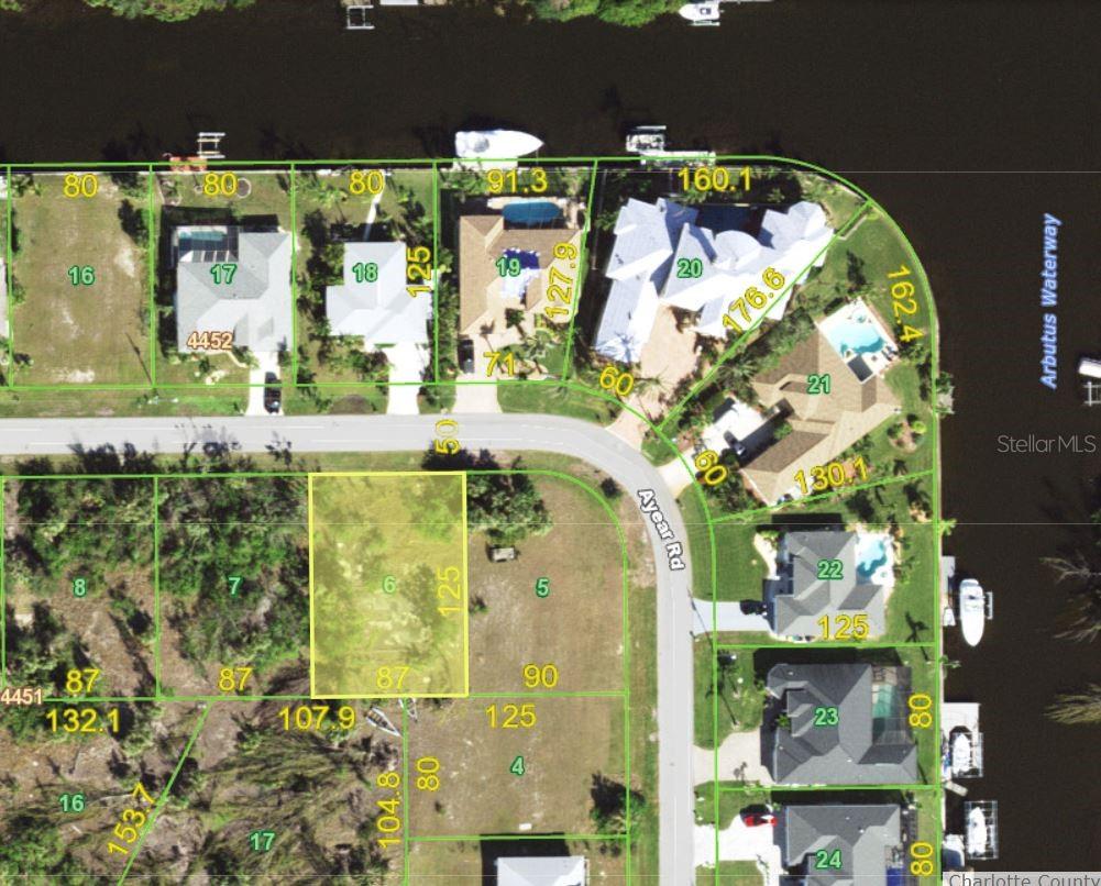 Great dry lot in the waterfront community of South Gulf Cove.  The lot sits across from large, upscale houses.  Central water, sewer and electric are available in front of the lot.  The lot is level and has a concrete house pad from the prior owner.  Great location for your next home.  Area is within a ten minute drive of Publix, area shopping, retail, golfing and Boca Grande.  The subdivision has an optional HOA with several amenities available if you join.  Architectural review and application is required.  Professional contractor should inspect concrete pad during inspection period.