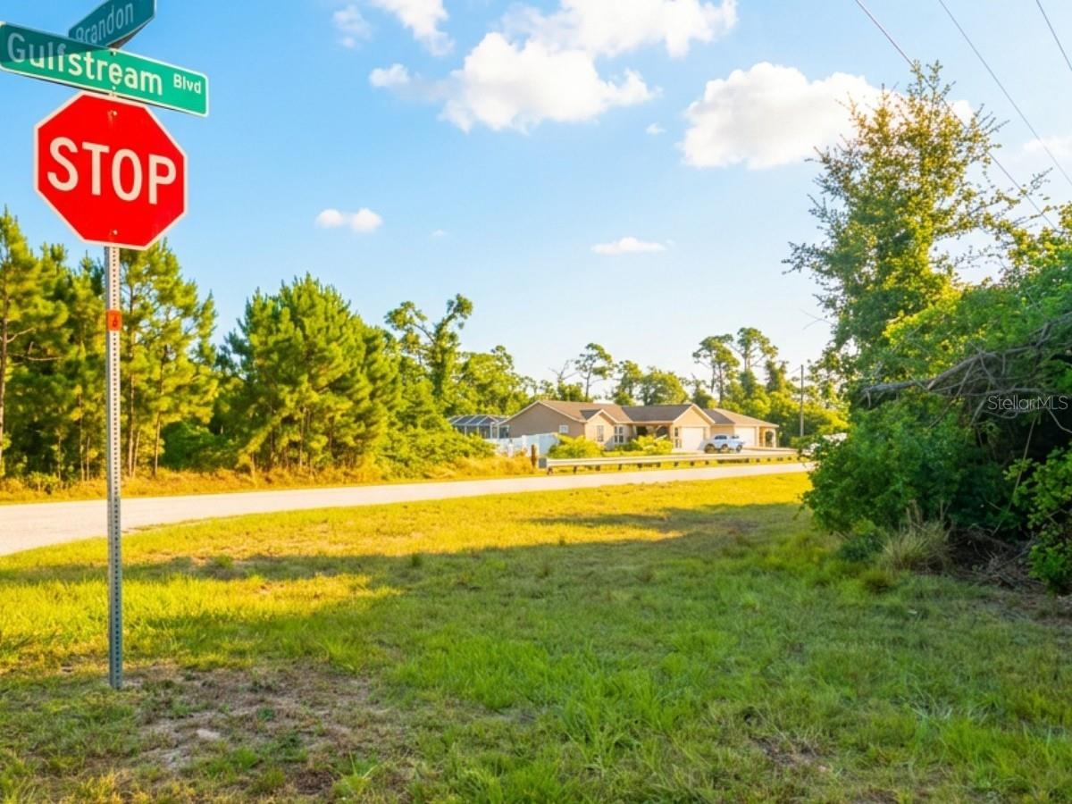 Prime opportunity to own a corner lot located at the intersection of Clarendon Ave and Gulfstream Blvd, one of the key roadways that shapes the layout and connectivity of the Port Charlotte area. This property sits directly across from a canal with access to the Myakka River, offering excellent potential for future waterfront living or investment. Recently subdivided along with the adjacent lot, both parcels are available for purchase—giving buyers the flexibility to acquire one or both, whether for a larger homesite, added privacy, or long-term investment strategy. Situated in a rapidly growing residential area, this location is just minutes from restaurants, markets, and new businesses that reflect the community’s expanding cultural diversity. With strong development momentum and a highly accessible setting, this property represents an exceptional opportunity in one of Port Charlotte’s most active growth corridors.