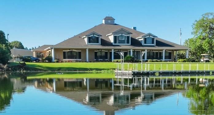 One or more photo(s) has been virtually staged. Now being offered at an improved price! A rare opportunity to own a private, gated 52-acre lakefront estate offering scale, privacy, and architectural presence—strategically located along State Road 60 between Tampa and Lakeland.

A long, winding drive framed by blooming azaleas, mature lychee trees, and classic Old Florida landscape sets the tone as you arrive at this extraordinary legacy property. At its heart lies a pristine, seven-acre private lake, creating a resort-like setting just steps from the residence—ideal for morning coffee, fishing, paddleboarding, or sunset views across open water.

The 9,349-square-foot custom two-story home was designed for both grand entertaining and comfortable everyday living. A wraparound porch, multiple sets of sliding pocket doors, and seamless indoor-outdoor flow connect the home to a screened resort-style pool and spa, expanding the living space into nature.

The primary kitchen anchors the home and was thoughtfully designed for large gatherings, featuring Thermador appliances, double ovens, warming drawer, dual sinks, an oversized center island, bar seating, lead-glass cabinetry, and a walk-in butler’s pantry with custom storage. A secondary kitchen located off the sunroom provides additional flexibility with a gas range, wine refrigerator, and direct pool access.

The expansive primary suite offers lake views, a private fitness room with wet bar, custom dressing rooms, and a spa-style bath with dual water closets—creating a true owner’s retreat. Additional features include a large custom laundry room, built-in vacuum system, skylit roofing, and thoughtful architectural details throughout.

Beyond the residence, the property functions as a true estate compound. A 5,000-square-foot metal barn with loft, two bays, office, and half bath provides versatility for car collections, equipment, hobbies, or business use. Infrastructure highlights include a 105kW Generac generator, a 12” deep irrigation well (675’), extensive road frontage, and three separate ingress/egress points, offering future flexibility.

Mature exotic fruit trees—including lychee, avocado, mango, banana, and pomelo—enhance the property’s self-sustaining appeal. With 1,428 feet of frontage on State Road 60, this estate combines privacy with accessibility: approximately 10 miles to Lakeland Linder International Airport and convenient access to I-4 and I-75.

Properties of this scale, privacy, and lakefront presence rarely come to market. Ideal as a luxury residence, multigenerational estate, private retreat, or legacy investment in one of Central Florida’s most strategic corridors.