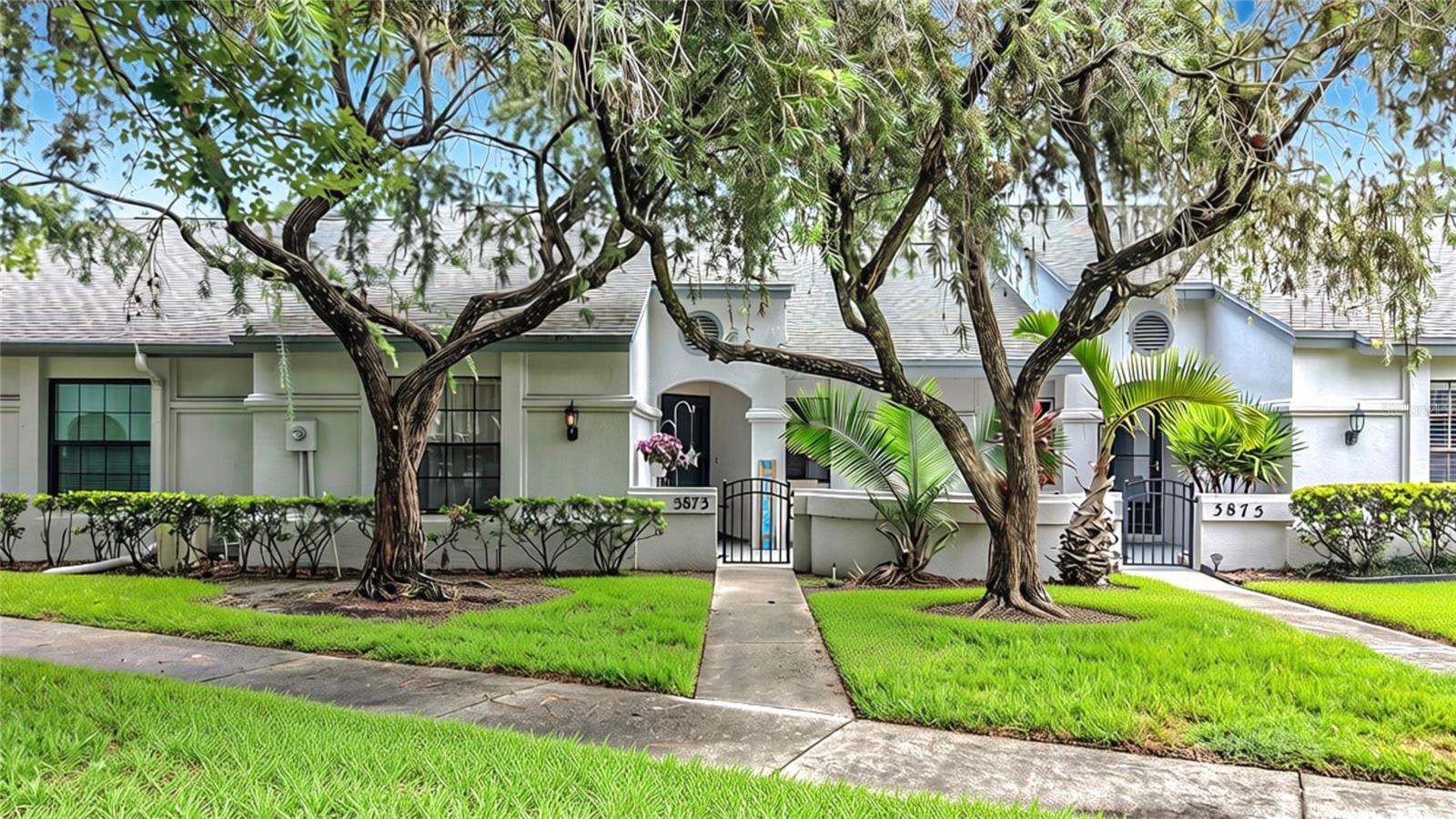 Location, Location, Location! Beautiful, 2 Bedroom, 2 Full Bath One Story Maintenance Free Villa Nestled in Desirable, "THE CLEARING" Enclave of Lansbrook! This Community is NOT a 55+ Community, the Pet Policy Allows For 2 Dogs, and the HOA Fee Includes Roofs! ... This Open Floorplan Boasts 10 Ft. Ceilings in the Great Room / Dining Room with Sky Lights Adding Beautiful Natural Light. There is Neutral Vinyl Flooring Throughout the Home and a Bar Area Has Been Added to the Dining Room ... Beautiful ENCLOSED FLORIDA ROOM Adds Additional Year Round Living Space and Extra Interior Storage with Newer (2023) Impact/Hurricane Windows ($14,700), Flat Roof ($2,687), Vinyl Flooring, and Gerber Blinds! ... The Updated Eat-In Kitchen Includes Neutral Vinyl Flooring and Plenty of Cabinet / Counter Space, and Is Open to the Dining and Great Room. All Appliances Stay Including Newer Stainless Steel Stove/Oven and Dishwasher (2023), Washer and Dryer (2025), and Bar Fridge (2023) ...  You Will Love the Spacious Master Bedroom with Trendy Barn Door Leading to Florida Room w/ En-Suite Bathroom and 2 Closets, One a Large Walk-In Closet...The Split Bedroom Floorplan Features a Large 2nd Bedroom, Full Hall Bath and Linen Closet. There is Plenty of Closet and Storage Space with 2 additional Hall Closets, and an Interior Attic with Pull Down Stairs....The AFFORDABLE HOA FEE Includes Roofs (flat roof over Florida Room not included), Exterior Paint, Exterior Maintenance, Water, Sewer, Trash, Lawncare and Community Pool! You Can Also Enjoy Walking, Biking, and are Less than 1 Mile to YMCA, Lansbrook Golf Course, Shopping, and Restaurants! Easy Access to Beaches, Parks and Tampa International Airport! Pet Friendly, Dogs OK...No Size or Weight Restrictions!  Of Comparable Zoned Public Schools, East Lake High School Has Also been Recognized as #1 in Pinellas County, #2 in the Tampa Bay Region, and #11 in the State of Florida! NO Flood Insurance Required!