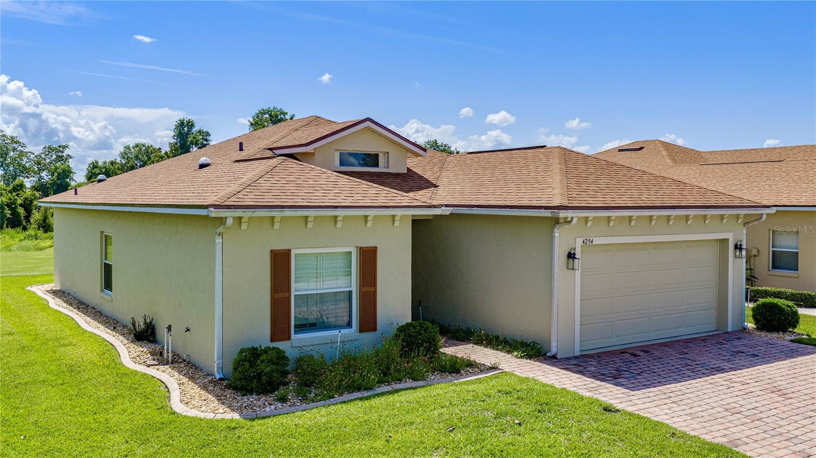Begin the next exciting chapter of your life in Lake Ashton, Central Florida's premier 55+ active-adult community, where this beautifully maintained and tastefully updated 2-bedroom, 2-bath home with a den enjoys a desirable location overlooking the Lake Ashton East Golf Course. From the moment you arrive, you'll appreciate the care and quality found throughout. The updated kitchen features newer appliances, granite countertops, and a large sun tunnel that fills the space with abundant natural light. Beautiful wood laminate flooring extends through the living room, both bedrooms, and the den, creating a warm and inviting atmosphere. Both bathrooms are enhanced with sun tunnels, while the spacious primary bath has been tastefully remodeled to include a walk-in shower with tile extending to the ceiling, a double-sink vanity, and a separate door providing privacy between the vanity and shower area. The enclosed veranda offers additional year-round living space with wood laminate flooring and retractable sunshades on every window, making it the perfect place to relax while enjoying the golf course setting. Throughout the home, newer double-pane windows tilt inward for easy cleaning and are complemented by elegant plantation shutters. The roof was replaced in 2018, providing added peace of mind. Even better, this exceptional home is being sold turnkey, including all furniture, electronics, furnishings, plus a 2021 Yamaha golf cart and charger, allowing you to begin enjoying the Florida lifestyle from day one. Beyond the home itself, Lake Ashton offers an unparalleled resort-style lifestyle with two 18-hole championship golf courses, a 26,000-square-foot clubhouse, a state-of-the-art health and fitness center, indoor and outdoor swimming pools, pickleball courts, a bowling alley, and an active calendar of clubs, activities, and social events. Combining an outstanding golf course location, thoughtful updates, turnkey convenience, and an impressive list of features, this is a home that truly must be experienced in person. Schedule your private showing today and discover the Florida lifestyle you've been dreaming of.