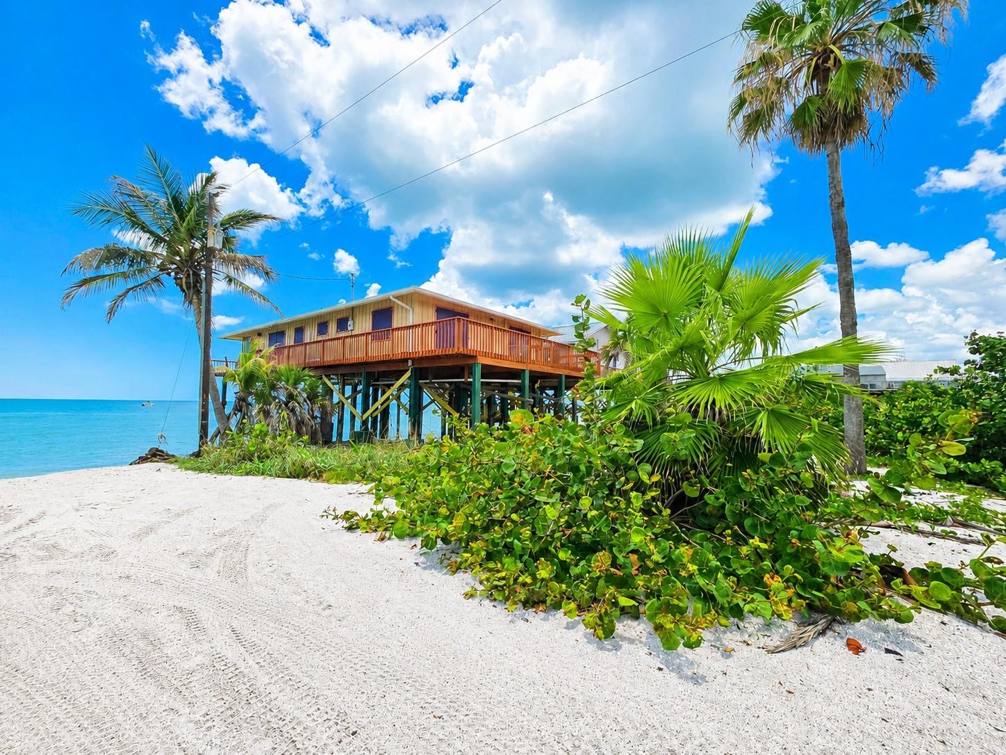 Experience the rare opportunity to own a true Old Florida beachfront retreat at 8595 Marsh Street in Placida. Nestled directly on the Gulf with panoramic water views and unforgettable sunsets, this gulf-front fixer upper is bursting with potential for investors, renovators, or anyone dreaming of creating their ideal island getaway.

Located in the secluded and highly sought-after Little Gasparilla Island community, this property offers the privacy and tranquility that waterfront buyers crave — accessible only by boat or private ferry, with miles of pristine sandy beaches just steps from your door. Whether you choose to restore the existing home or reimagine the site entirely, the value here is in the unbeatable location and direct Gulf frontage.

Wake up to the sound of waves, spend your days shelling, fishing, or boating, and enjoy endless sunset views from your future coastal retreat.