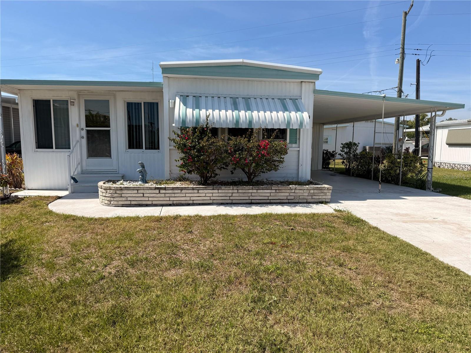 MOTIVATED SELLER! Located in desirable 55+ Leisure Lake Co-Op! Newer kitchen & appliances with spacious pantry. Sold turn key furnished.  Large enclosed porch for dining & entertaining. Community pool is salt water & heated. Amenities include pickleball, tennis court & shuffle board, fitness center, clubhouse, laundry & library. Active & pet friendly community with year round activities. Free shuttle to the Palmetto bus station & about a mile away to the 7-11. (Certain streets in Leisure Lake are pet approved). Close to 275, 41 & 301, Walmart under 3 miles away & within an hour of 3 major airports: Tampa International, Clearwater/St Pete & Bradenton/Sarasota. LOW LOW HOA $212/mo includes mowing 1x week, water, trash, recycling & sewer.