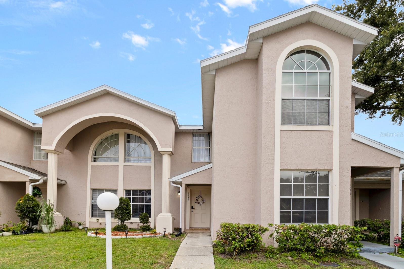 Whether you live here year-round or use it as your Florida escape, this property offers the best of both worlds, personal enjoyment and rental income potential when you’re away. Welcome to this beautifully maintained and fully upgraded townhome in the heart of Kissimmee, located in the quiet, gated community of Windsor Oaks. This spacious 3-bedroom, 2.5-bath home features a flexible layout with two master suites upstairs and a third bedroom on the main level that can also serve as a home office, den, or gym. Major improvements give this home incredible value and peace of mind: the roof was replaced just 8 months ago, the A/C is only 2 years old, the water heater is brand new, the sliding glass door recently installed new, and all appliances including washer and dryer are included.You’ll find a bright and inviting open-concept living and dining area that flows seamlessly into the kitchen. The kitchen has been fully upgraded with new cabinets, modern fixtures, a farmhouse sink, quartz countertops with a beautiful backsplash, and a new garbage disposal. All bathrooms feature new cabinetry and fixtures, while the upstairs and bedrooms are finished with new laminate flooring. Windsor Oaks provides a low HOA, short-term rental approval, and a community pool, making this property ideal for investors and first-time homeowners alike. With shops, restaurants, and entertainment nearby, this home blends modern upgrades with everyday convenience.