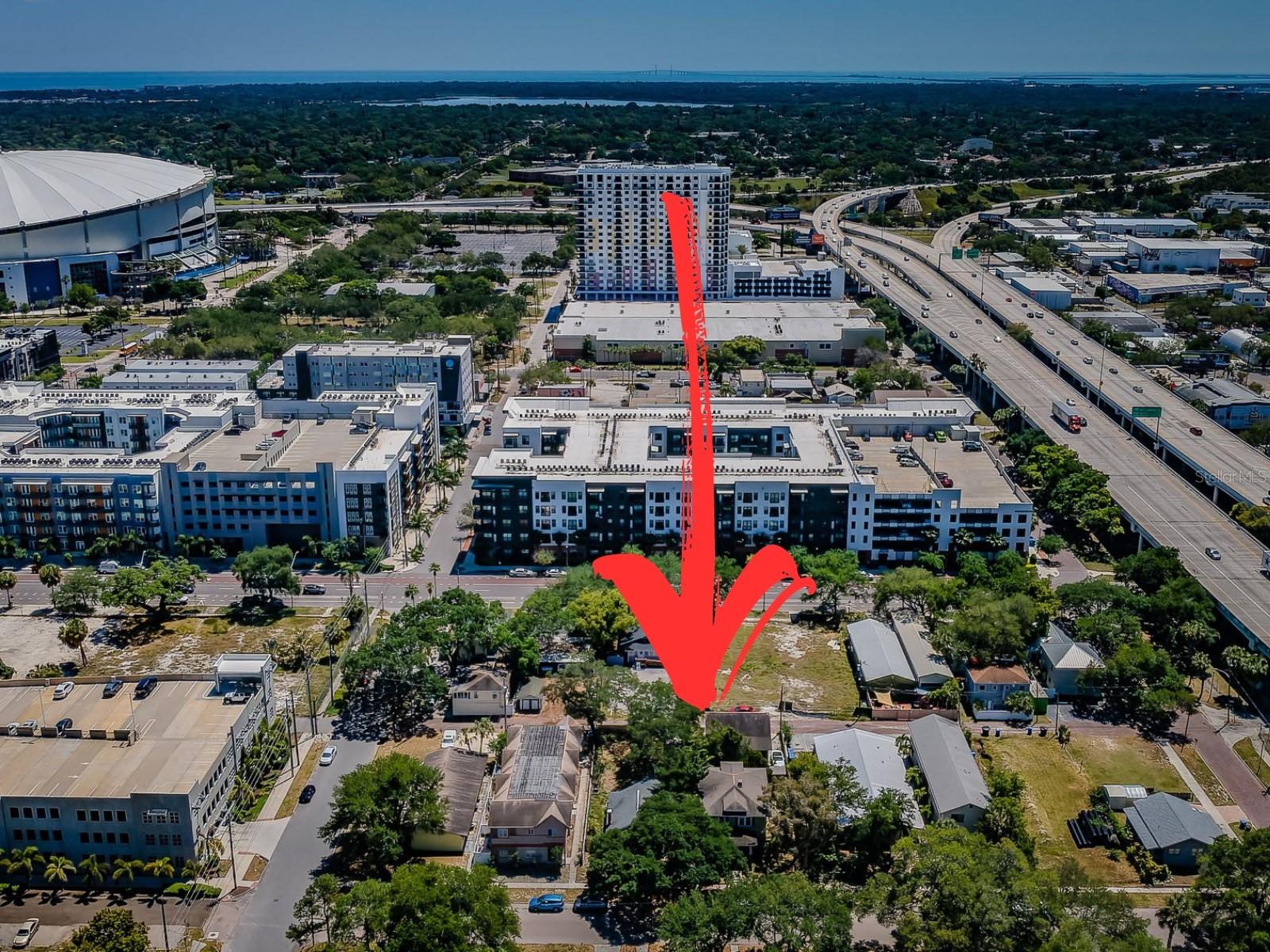 **This listing encompasses two adjacent DC-2 zoned lots, 1720 and 1726 2nd Ave N, with the listing price representing both lots' combined value.**. Presenting a remarkable development opportunity in the heart of St. Petersburg, just two blocks north of Central Ave — a vibrant and rapidly evolving part of the city.  Spanning a generous 12,700 square feet total, 100 x 127 ft in dimension, this prime location offers a wealth of potential given the immediate proximity to the Edge District, Grand Central, and the soon-to-be redeveloped Tropicana Field. The DC-2 zoning allows endless opportunities for mixed-use or residential development. Imagine crafting a mid-rise complex featuring luxurious apartments, chic condos, or a townhouse community with rooftop decks; all are viable options given the DC-2 zoning. With conceptual designs in hand by local architect Behar + Peteranecz, the plans illustrate two buildable options that conform with zoning. These forward-thinking designs include spacious 3-story homes, each with a roof deck perfect for capturing panoramic city views and over 1,900 sqft of living space alongside convenient ground-level garages. Or, should you choose to pursue larger developments, the plans illustrate a 32-unit apartment/condo complex with the potential to increase the unit count to 54 units by going through the bonus approval process. Nestled on a serene, tree-lined brick street, yet a brisk walk from Central Avenue's array of boutique shops, restaurants, and bars, the site relishes a quieter setting paired with the allure of city living. This development opportunity is not just a property but the promise of a future landmark contributing to the dynamism of Downtown St. Petersburg. Explore the endless possibilities of a location where development dreams have the potential to become a reality. Renderings based on conceptual designs, not permitted plans.