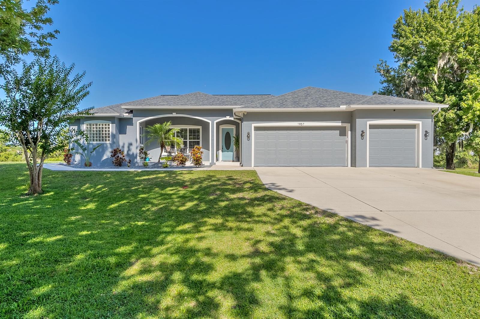 Unbelievable!! This 3 bedroom 2 bathroom, 2.5 acre estate is just unbelievable and so meticulously cared for. Enjoy morning coffee on the front porch while the dogs are running after squirrels and the song birds are singing away. Upon entry you will notice beautiful wood look ceramic tile hugging the updated baseboards in the common areas and a volume ceiling. Natural light peers in from the fun family room and into the rest of the house. The chefs area has gorgeous granite countertops, plenty of cabinets, and stainless steel appliances. Flooring, granite and appliances all done 2016/2017. Have breakfast in the adorable nook while watching Saturday morning cartoons right there in the living room. All bedrooms are great in size but the master is pretty special. It has a bonus space which is great for an office, mini gym area or even a private living room. The master closet is reinforced making it the safest room in the house. Its Florida and having a pool is not a luxury its a must. Your salt water pool was just resurfaced in 2017, new salt cell in 2022 and all the components and equipment replaced in 2017 as well. The patio is perfect for grillin and chillin (pavers replaced in 2017) and a fun fact is the sliding door leading to the pool area is pocketed and opens all the way up making the inside and outside one big area. If 900 sq ft is not enough room for your toys in the garage there is an extra storage shed with a loft. The garage floor was just epoxied in 2019 and is absolutely pristine. The roof and air conditioner were replaced in 2019 as well as a fresh coat of exterior paint. Youre thinking, wow this house has it all but there's more. Not only is there an RV hook up but a portion of the land that you own across the street was turned into a private shooting range. Holy smokes. I dont think you could ask for more. Your new home is beautiful and all redone in the last 5 years. Private and tucked away but 5-10 min to everything including the beach. This is it!! ;Water: City
