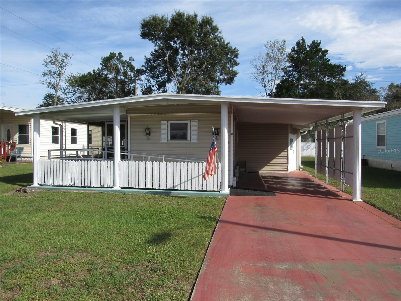 Help bring this unique home back to its former glory. This Handyman special is located in the Pet Friendly area of Betmar Acres. An active and friendly 55+ community where you own your land. This Spacious singlewide with additions features a Large raised screen room, air-conditioned glass enclosed Florida room with sliding glass door a spacious combined living room/dining area with bump-outs, decorative exterior finishes & neat original built-in lighting. The compact front kitchen frees up lots of space for the main living areas but still has plenty of room for cooking & storage. located at the back of the home you will find the original master bedroom and the main bathroom. The main bathroom is nicely sized it features a low-step walk-in shower & double sinks & is designed in a Jack & Jill style, meaning it can be accessed both from the hallway and the master bedroom. There's also a nice size add-on guest bedroom which is large enough for a King-sized bed & features its own in-suite bathroom. If you need more storage space, there's also an add on utility room with washer/dryer hook-ups a work bench & double door for golf cart parking. Overall, this home has great potential and with a little TLC & your imagination, it can be transformed into a stunning living space that captures its former glory. Whether you're looking for a project, a place to put a new home or simply want to restore a unique property, this handyman special is worth considering.
