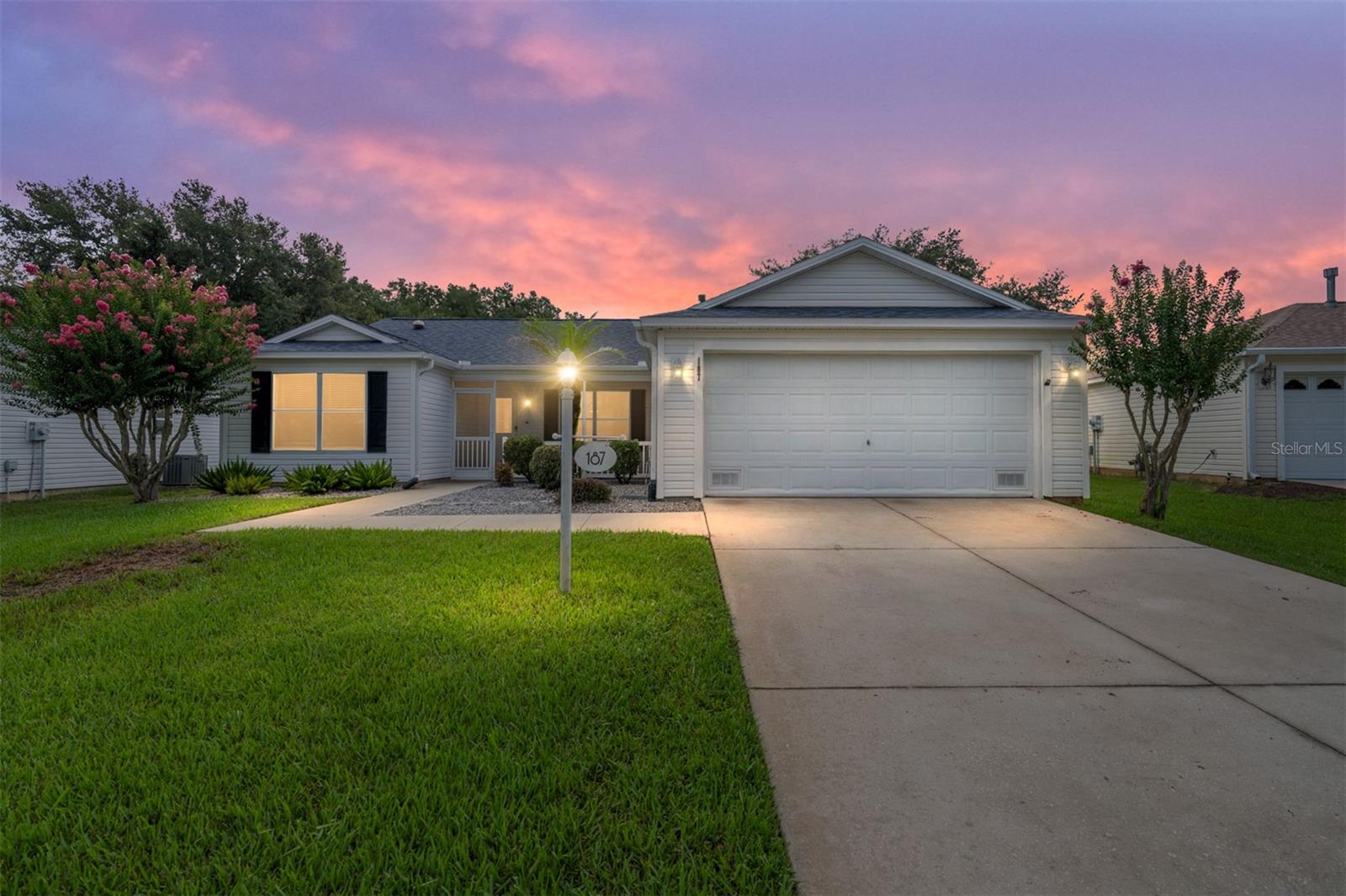 Welcome to this stunning LUX TURNKEY (EVERYTHING IN THE HOUSE, STAYS IN THE HOUSE!), AMARILLO model in the highly sought-after VILLAGE OF CAROLINE(1 Mile away from Lake Sumter Landing), featuring OVERSIZED and PRIVATE "PARK LIKE" BACKYARD with beautiful trees and green as far as the eyes can see! You'll never get tired of watching the sunrise year round in the GLASS ENCLOSED, UNDER AIR, 12x15 (additional 172sf) LANAI or kick back and relax in the bonus FLORIDA ROOM! BUYERS WILL LOVE THIS FLOORPLAN! With a newer ROOF 2023, LOW BOND BALANCE $6,134, OFFERING ~1 YEAR HOME WARRANTY~and DESIGNER CURATED, FULLY FURNISHED, this home is truly a standout - CHOCK FULL of VALUE!  Step inside and be greeted by SOARING VAULTED CEILINGS enhancing the open, airy feel, with well maintained vinyl flooring and luxury vinyl plank, FRESHLY PAINTED INTERIOR, UPGRADED DESIGNER FANS with LIGHTS/REMOTES, 3 SOLAR TUBES, and ALL NEW WINDOW DRESSINGS throughout the entire home makes for a bright and cheery atmosphere. The open concept living room, dining room and kitchen with counter bar top makes it ideal for entertaining and everyday enjoyment. The kitchen shines with NEWER appliances including a highend BOSCH dishwasher, STAINLESS STEEL, upgraded LG refrigerator with clear door, and GAS stove—making meal prep a pleasure. The spacious primary suite features a GORGEOUS KING BED furniture SET, 2 walk-in closets, and a roomy en-suite bath with DUAL HIS AND HER SINKS and PRIVATE WATER CLOSET with door. TWO additional bedrooms with built in closets and SEPARATION POCKETDOOR from main living area form a PRIVATE SIDE OF THE HOUSE for guests to enjoy - HALL CLOSET for additional storage is a plus. The guest bath includes a tub/shower combo and a DEEP LINEN CLOSET for the "extras". Enjoy year-round relaxation in the FLORIDA ROOM, fully integrated into the home as a BONUS hang out space. The INSIDE LAUNDRY area is equipped with washer, dryer and upper cabinets. The TWO CAR GARAGE has plenty of storage cabinets and is pristine with FRESHLY PAINTED WALLS and BASEBOARDS. The front porch is a screened-in lanai and provides the perfect place to unwind and take in the serene views of the sunsets. 2005 Trane HVAC system (regularly serviced by Munns). This is a MOVE IN READY GEM_ LUX TURNKEY WITH RARE "COUNTRY LIKE" BACK YARD! RING DOORBELL and QUICKSET front door lock included. This home combines comfort, style, AND an exceptional setting IN A GREAT LOCATION - IN BETWEEN THE 66'S, Minutes to COCONUT COVE RECREATION CENTER AND POOL, 8 miles to BROWNWOOD PADDOCK SQUARE, 6.2 miles to SPANISH SPRINGS TOWN SQUARE Close to shopping, grocery stores, restaurants, golf courses, and much much more!