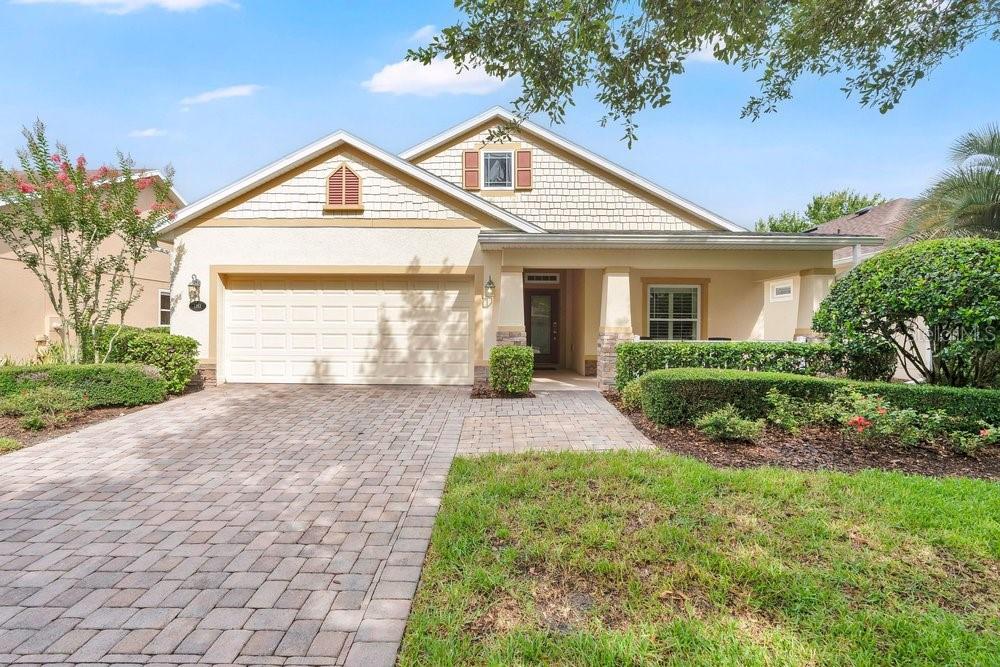 Take a look at this stunning Shea-built home in the gated and guarded Victoria Gardens Active 55+ Community. A charming nostalgic front porch with an elegant glass front door warmly invites you into a fully open floor plan filled with upgrades and comfort features. Tiled floors set a welcoming tone, while the gourmet kitchen boasts stainless steel appliances with gas range, a breakfast bar with granite countertops, a custom backsplash, and maple cabinets with pull-outs. The dining area, highlighted by tons of natural light, flows into the cozy family room, where French doors open to an enclosed sunroom and a large lanai with sunshades. Enjoy double-pane windows and overlooking the private backyard surrounded by lush greenery and natural hedges. Inside laundry room and washer and dryer stay. The VP community offers a private clubhouse with dining, a bar, game and card rooms, pool tables, a fitness center, a heated resort-style pool, lighted tennis and pickleball courts, a library, arts and crafts, travel clubs, and a ballroom with a dance floor. The championship golf course is just across the street, and total lawn care, reclaimed water, cable HD TV, and high-speed internet are included. Conveniently located minutes from Publix, Starbucks, I-4, medical facilities, and transportation.