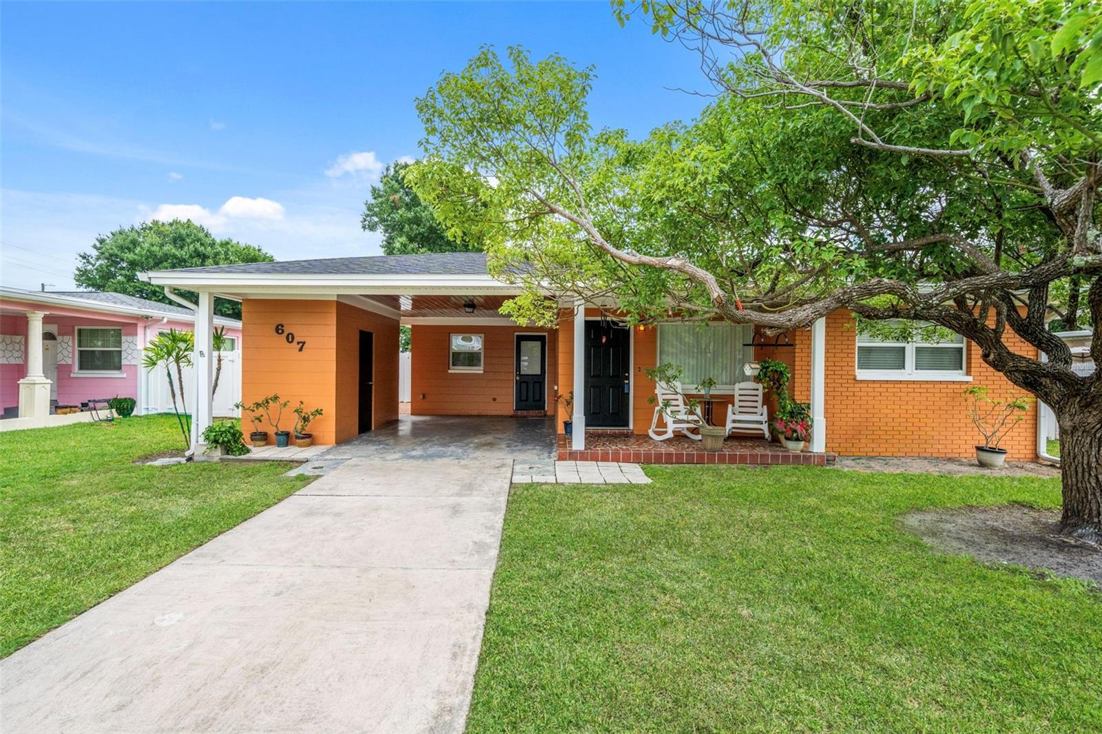 Incredible opportunity to own a stunningly well-maintained home in Central Tampa! Minutes from Downtown Tampa, Raymond James Stadium, Midtown Tampa, Hyde Park, SOHO, Bayshore Boulevard, shopping, dining, parks, and entertainment. This move-in-ready home offers a spacious open-concept floor plan featuring an oversized kitchen that seamlessly flows into the family room, plus a versatile bonus room perfect for a home office, formal living area, playroom, or flex space. The main living areas showcase beautiful hardwood flooring, creating warmth and character throughout the home.

Pride of ownership shines throughout with extensive renovations and updates completed over the years. Major improvements include updated electrical wiring and panels, PVC plumbing upgrades, energy-efficient windows, attic insulation, HVAC systems, kitchen cabinetry and countertops, bathroom renovations, recessed lighting, French doors, and a covered patio addition. The utility room is conveniently located in the carport, housing the washer, dryer, and water heater.

Recent capital improvements provide exceptional peace of mind, including a new shingle roof with secondary water barrier and perimeter decking (2023), preventative drywood termite treatment (2023), new exterior HVAC unit (2024), upgraded bedroom flooring and fresh interior paint (2025), professionally milled and epoxy-coated drain lines with new PVC connections and a transferable 25-year warranty (2025), refinished hardwood flooring in the kitchen and family room (2025), and updated bathroom hardware (2026).

Step outside to enjoy the covered patio, paver entertaining areas, and a spacious backyard with ample room to add a pool and create your own private outdoor oasis. Additional features include a desirable HIP roof design, finished wood ceilings on the front porch and carport, gutters, dimmer switches, abundant kitchen electrical outlets, and original terrazzo flooring beneath the finished flooring. Situated in Flood Zone X with no HOA or CDD fees, just around the corner from Midtown Tampa with convenient access to public transportation, this meticulously maintained property offers an outstanding combination of location, quality, and long-term value. Don't miss this rare opportunity to own a home where the major updates have already been completed for you!