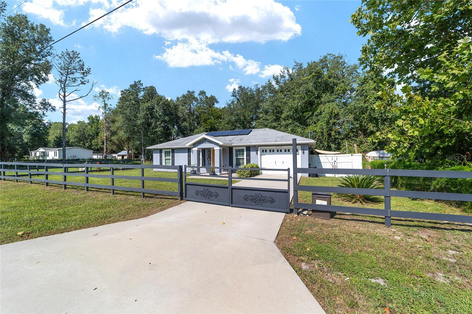 Better than new! Built in 2019 with upgrades including wood-style flooring, tiled garage & covered lanai. Energy efficient with premium insulation & paid solar system. Move-in ready, 3.5 miles to World Equestrian Center with excellent short-term rental potential. Half-acre fenced lot , 3/4 mile to Hwy 40, 10 miles to Rainbow River, 23 miles to Florida's Nature Coast & Gulf.