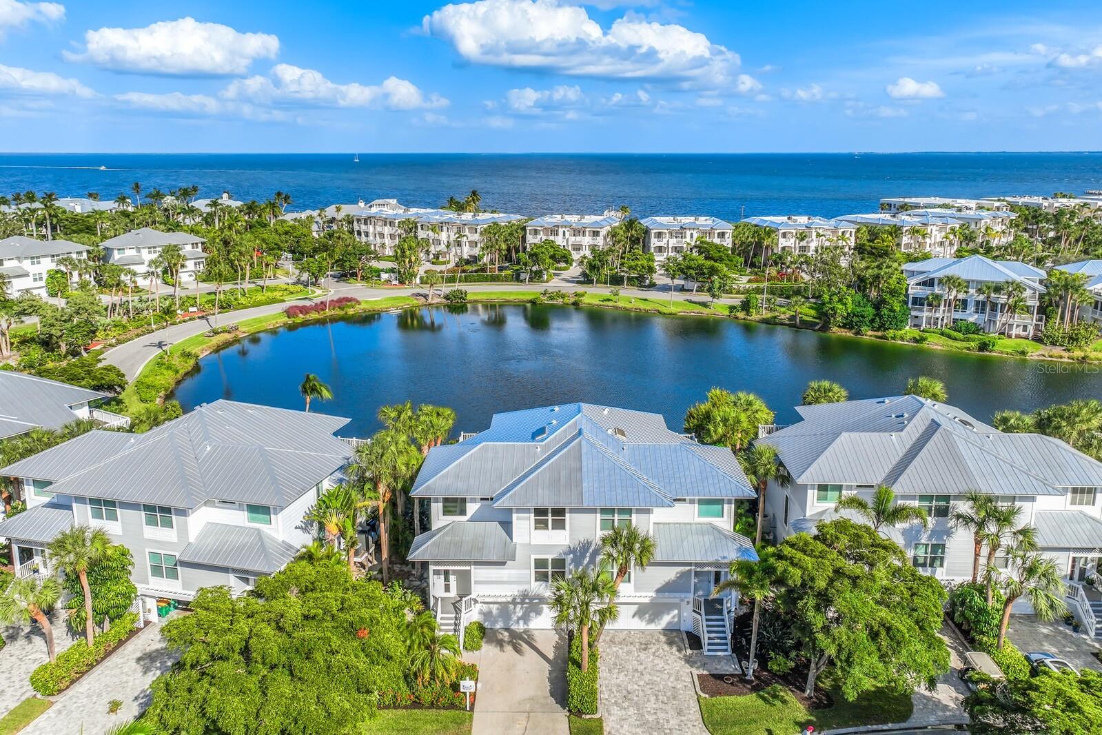 Quiet Luxury in Boca Grande! Welcome to the recently completed lakeside home in Boca Bay's South Village. This impeccably redesigned 3 bedroom, 3 and 1 half bath home is the epitome of Luxury and Comfort! This is a "one of a kind Kentia" featuring a new floor plan which includes a second primary suite on the main level, the addition of a powder room for guests, an open floor plan with soaring ceilings and a fireplace with custom built-ins, all impact windows and doors, and perhaps most importantly a state of the art kitchen including stunning Taj Mahal Quartzite counters and a built-in bar for entertaining. This amazing home is located in the premier community of Boca Bay on the charming island of Boca Grande. The amenities include a fishing pier on Charlotte harbor, a top notch tennis program with pros, 4 pools, a fitness center, and a renovated clubhouse with waterfront dining and breathtaking views.