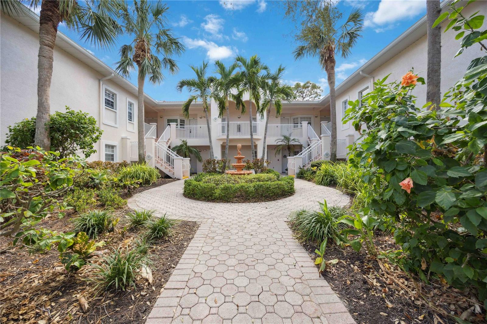 Virtually Staged. Fantastic opportunity to live on Palmer Ranch in the beautiful community of Plaza de Flores. The Mediterranean courtyard welcomes you into the first floor condo with a split floor plan. The open kitchen boasts granite countertops, stainless steel appliances, and Kraftmaid cabinetry. The unit has been recently painted inside and out, with brand new tile roofs in 2023 and new paving and carports in 2025. The community offers a heated pool and hottub, tennis court, fitness room, and clubhouse with kitchen, library and complimentary internet. Cable, water, trash, and sewer are all included in the monthly fee. Only 6 miles to the world-famous Siesta Key beach. Shopping (including Costco) is right around the corner, so you can easily find everything you are looking for. Conveniently located between downtown Sarasota with all of its restaurants, culture, arts and events, and Nokomis and Venice to the south. Great opportunity, great location! Come claim your new slice of Paradise today!