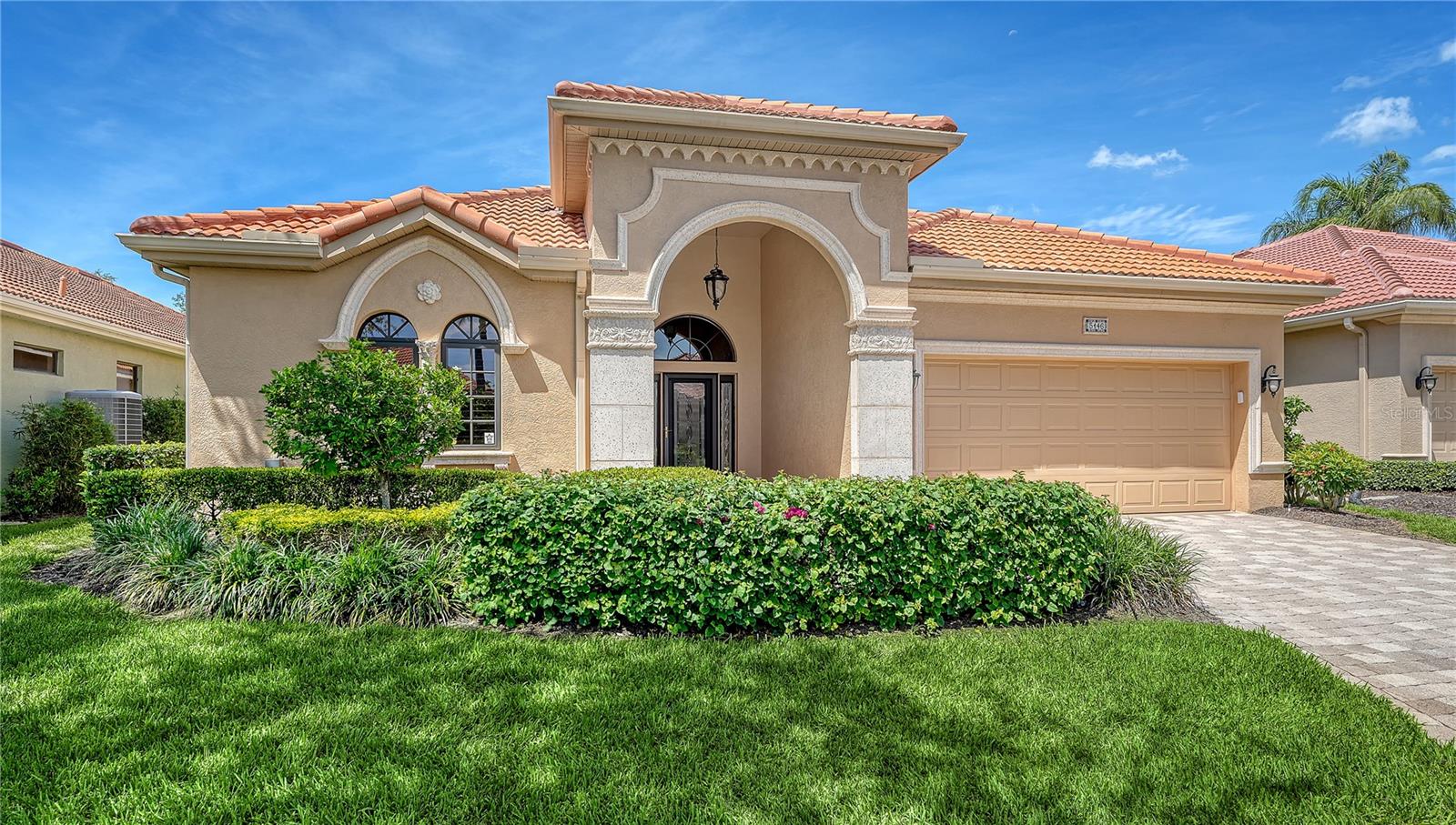 Beautifully upgraded& expanded Tuscan style maintenance free home located in The Vineyards of Silver Oak on Palmer Ranch. Custom built by Gibralter builders & expanded to nearly 2600 sq. ft. under air. Recent upgrades include: New tile roof in 2019,replumbed in 2023, new stainless appliances in kitchen & new washer & dryer. 3 bedrooms (hidden office closet), 3 baths 2 full & 1 half bath. Upgraded Travertine look tiles, custom wood look floors in the primary & second bedrooms. Very open, light & bright great room floor plan. Kitchen has wood cabinets & granite counters. Large extended screened lanai overlooking very private preserve views ( no road noise). This boutique community of 72 homes providing maintenance for complete landscaping & irrigation maintenance. A private community center available only to The Vineyards offers a pool, fitness & cozy clubhouse with kitchen for special events. The Vineyards is located in this Executive community of Silver Oak on Palmer Ranch close to shopping, restaurants,  The Legacy bike trail & just minutes from world famous Siesta Key Beach.
