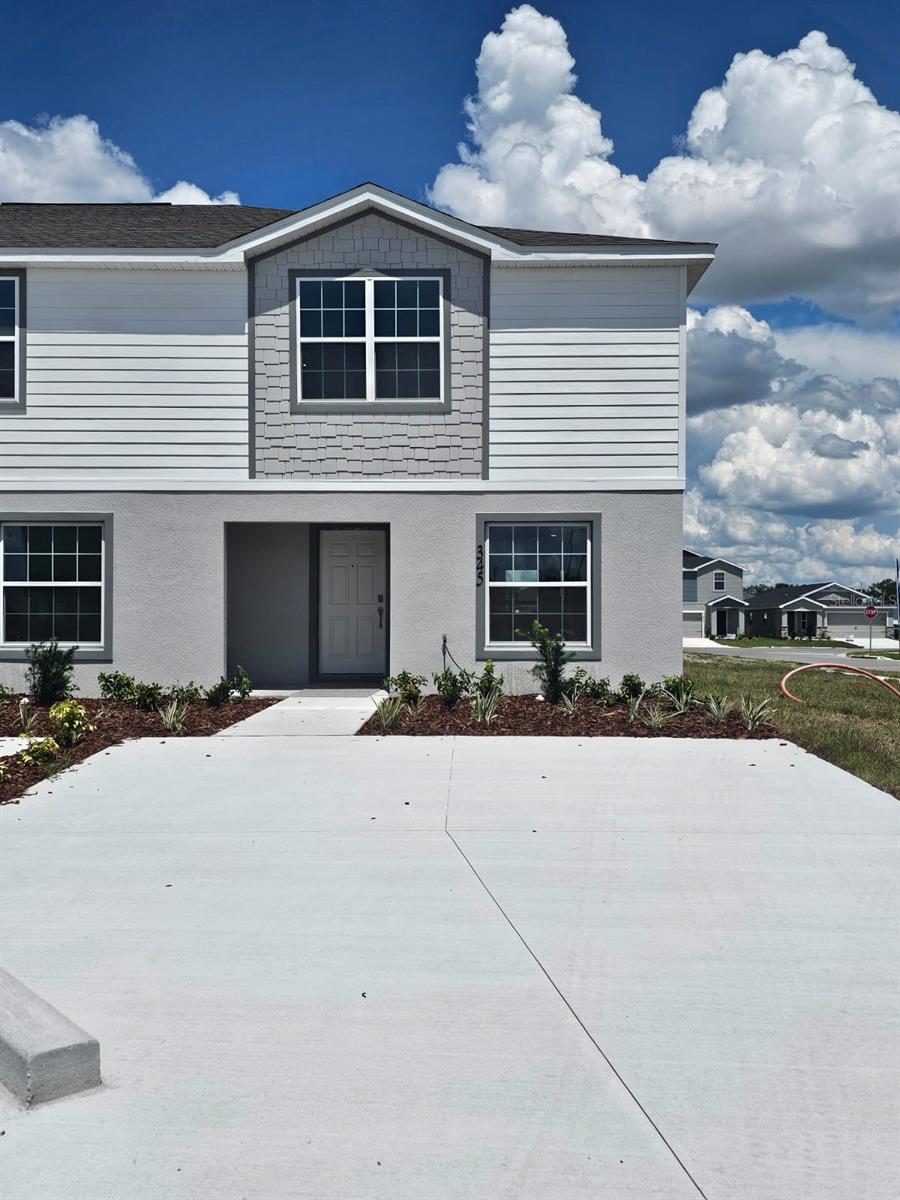 Under Construction. Beautiful 2-story new construction townhome located in the brand-new Harbor at Lake Henry community in Winter Haven. This home offers 3 bedrooms, 2.5 bathrooms, and approximately 1,604 sq ft of heated living space. The first floor features an open-concept layout with a spacious gathering room, a well-appointed kitchen with shaker-style cabinetry, stainless steel appliances, pantry, and access to a covered lanai. The second floor offers comfortable bedrooms, including a private primary suite. Conveniently located off Lucerne Park Road/State Road 544, approximately one mile west of Highway 27, with access to shopping, dining, daily conveniences, and nearby Chain of Lakes boat ramps.