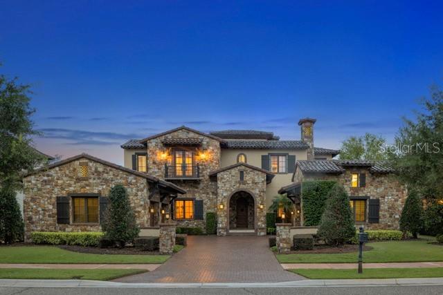 Welcome to Your Enchanted Retreat! Step into a fairytale lifestyle and luxurious whimsical charm in the sought after neighborhood of Golden Oak!  This remarkable 5-bedroom, 5-bathroom estate is nestled on a picturesque sparkling lake. Disney touches throughout are inspired by legendary stories, including a two-story library. Upon entry, you’re greeted by a quaint courtyard and sparkling fountain, then, the grand staircase and sunlit gallery with gracious views of the outdoor living area and water features beyond. From its extraordinary construction quality to its chef's kitchen equipped with premium appliances, ample counter space, and a warm and inviting gathering space, every detail of this home exudes timeless elegance and comfort. This exceptional estate offers a perfect blend of luxury, comfort, and whimsy. Don't miss the chance to make this enchanted retreat your own! 
Golden Oak at Walt Disney World® Resort is a residential resort community where families can live in the embrace of luxury, privacy, and the magic of Disney. This gated community features distinctive neighborhoods of magnificent homes, expansive natural preserves, and inviting amenities—including access to Golden Oak’s private clubhouse, Summerhouse, with superb food offerings served in a casually elegant dining room, courtyards, pool area, fitness facilities, and family room. In addition, residents have access to Club Life, Your Special Connection to the Magic, including access to the Golden Oak Member Services team, park transportation, signature club events, theme park experiences, and much, much, more. Also at Golden Oak is Four Seasons Resort Orlando at Walt Disney World® Resort, which hosts an 18-hole Tranquilo golf course, full-service spa, meeting facilities, and superlative restaurants.