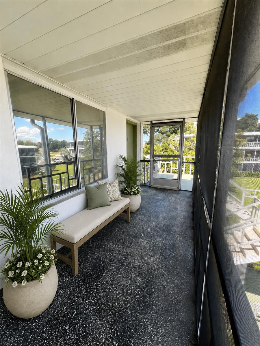 Virtually Staged. Perched on the third floor, Unit A38 at Winter Haven Condominiums offers the perfect blend of privacy, convenience, and beautiful views. As an end unit, you'll enjoy added peace and quiet along with an abundance of natural light throughout. Worried about stairs? Don't be. Elevator access makes coming and going a breeze. Inside, this move-in ready condo features updated flooring, newer kitchen cabinets with soft-close doors, and fresh interior paint, creating a bright, welcoming space that's ready for your personal touch. Just outside your door, the screened breezeway provides the perfect spot to start your day with a cup of coffee, unwind in the evening, or simply sit back and unwind in the evening with your favorite book and a refreshing breeze. The lifestyle doesn't stop there. Relax by the community pool, challenge friends to a game of shuffleboard, or gather with neighbors at the outdoor kitchen and grilling area. Covered, assigned parking keeps your vehicle protected and is conveniently located just a short distance from the building. Whether you're searching for a full-time residence or the perfect seasonal Florida getaway, Unit A38 offers low-maintenance living in a welcoming community designed for comfort and relaxation. Schedule your private showing today and discover why this charming condo feels like home.