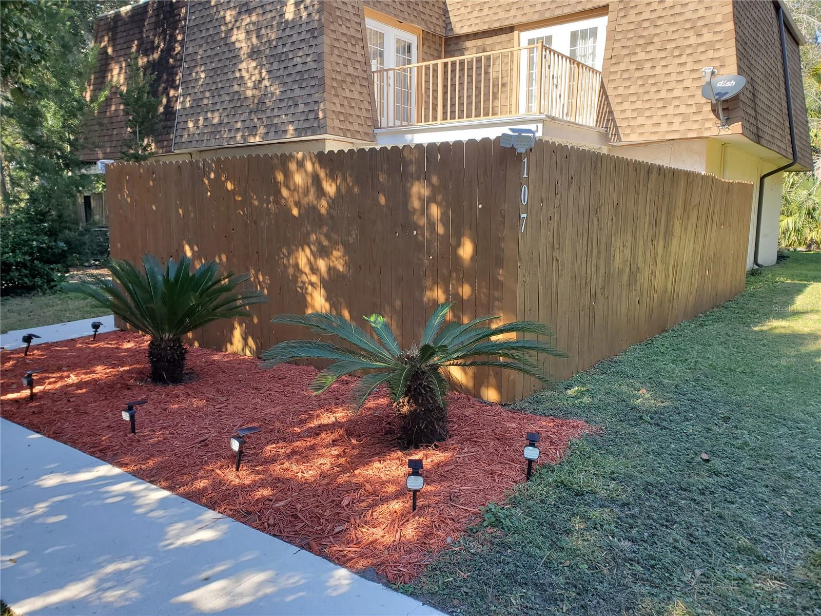 Turn key- Starter or Small Family home. Secluded/Private Townhouse situated along Jackson St (away from parking). Sugar Mill Historic Gardens back to Jackson-no housing across street. Only 2.8 miles to beach! Old, majestic oaks offer shade relief on hot Florida days. Saves electricity. Fenced patio & garden. Fireplace for Winter days. Large eat-in kitchen with ceramic cooktop. Newer items include Microwave/Dishwasher/Garbage Disposal/Water Heater/outdoor A/C/ Faucets/Sinks/1/2 bath vanity/1st Floor flooring/Stairway carpet. Sliding glass Pella doors with sliding screens in both LR & Kitchen allow easy access to patio. Deep closet off kitchen with hooks for jackets, ample room for brooms,vac/storage. Upstairs offers 2 bedrooms with shared balcony. Over-sized Master BR with 2 large closets. Full bath attached to Master yet accessible thru hall for 2nd BR. Hall linen closet. Large storage closet & attic at top of stairs. Conveniently close to beach, restaurants, stores, gas stations, both interstates -I-95 & I-4 for easy access to FL attractions & areas of interest. Within 1.5 hours (St Augustine, Jacksonville, Orlando, Ocala & West Coast of FL I-75). Just unpack & enjoy!