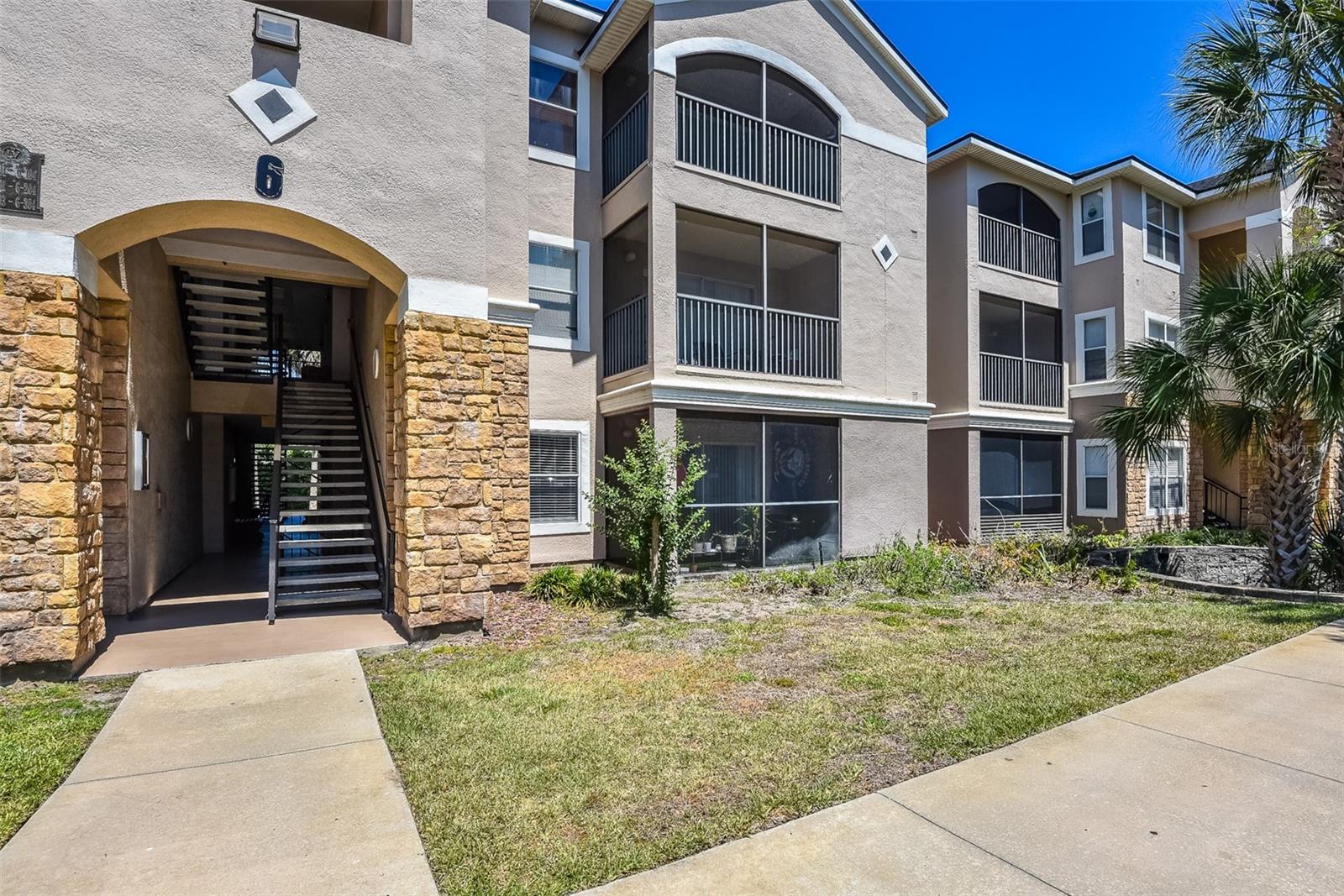 Welcome to this beautifully maintained 2-bedroom, 2-bathroom first-floor condo in the gated community of Villaggio on the Lakes featuring a VA ASSUMABLE loan opportunity for qualified buyers with an approximate 4.5% interest rate and balance of approximately $172,000, offering the potential for below-market financing. This move-in-ready condo offers an open and split-bedroom floor plan designed for both comfort and privacy, along with a spacious living area perfect for relaxing or entertaining. Enjoy easy maintenance with luxury vinyl plank flooring throughout and no carpet anywhere in the unit. The kitchen features newer stainless steel appliances paired with tile backsplash for a modern, cohesive look. A convenient indoor laundry room adds extra functionality, while a new bathroom vanity provides an updated touch. Both bedrooms offer large walk-in closets with plenty of storage space. The open living and dining areas flow seamlessly to the screened-in patio, creating the perfect spot to enjoy your morning coffee or unwind in the evenings. As a first-floor unit, there are no stairs to climb, offering added convenience and accessibility .Residents of this gated community enjoy resort-style amenities including a lakeside pool and spa, fitness center, car wash station, grilling areas, and beautifully maintained grounds. The monthly condo fee includes internet, cable, and valet trash service for easy, low-maintenance living. Conveniently located in the heart of Port Orange, you are just minutes from A+ schools, shopping, dining, medical facilities, entertainment, and everything you need.