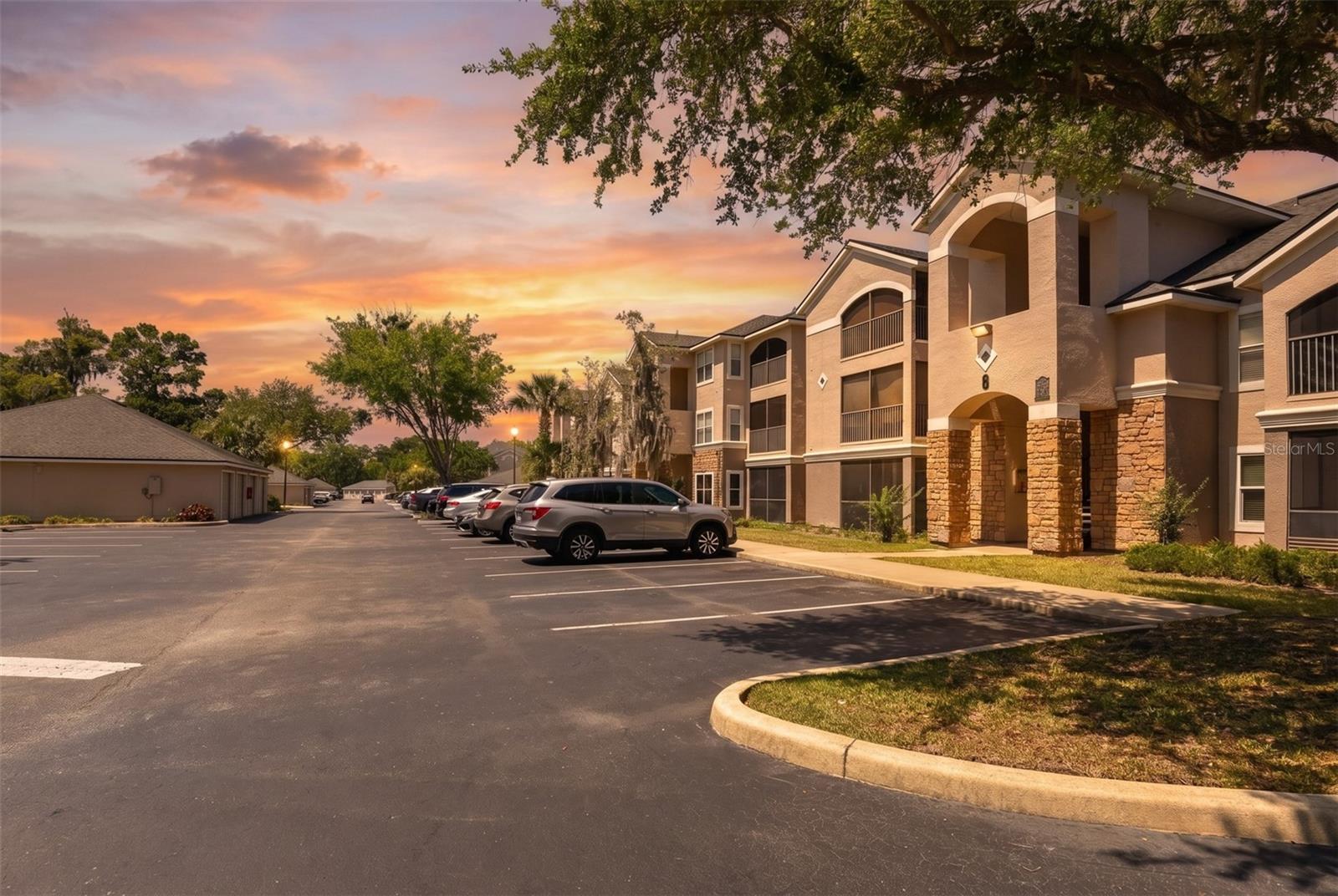 Welcome to this beautifully maintained 2-bedroom, 2-bathroom first-floor condo in the gated community of Villaggio on the Lakes featuring a VA ASSUMABLE loan opportunity for qualified buyers with an approximate 4.5% interest rate and balance of approximately $172,000, offering the potential for below-market financing. This move-in-ready condo offers an open and split-bedroom floor plan designed for both comfort and privacy, along with a spacious living area perfect for relaxing or entertaining. Enjoy easy maintenance with luxury vinyl plank flooring throughout and no carpet anywhere in the unit. The kitchen features newer stainless steel appliances paired with tile backsplash for a modern, cohesive look. A convenient indoor laundry room adds extra functionality, while a new bathroom vanity provides an updated touch. Both bedrooms offer large walk-in closets with plenty of storage space. The open living and dining areas flow seamlessly to the screened-in patio, creating the perfect spot to enjoy your morning coffee or unwind in the evenings. As a first-floor unit, there are no stairs to climb, offering added convenience and accessibility .Residents of this gated community enjoy resort-style amenities including a lakeside pool and spa, fitness center, car wash station, grilling areas, and beautifully maintained grounds. The monthly condo fee includes internet, cable, and valet trash service for easy, low-maintenance living. Conveniently located in the heart of Port Orange, you are just minutes from A+ schools, shopping, dining, medical facilities, entertainment, and everything you need.