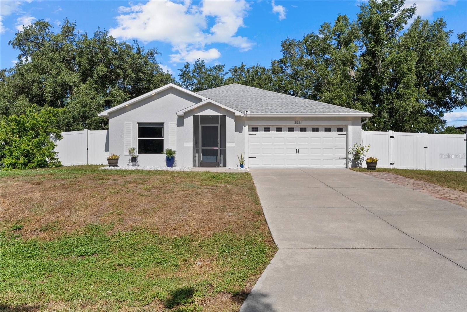 Welcome home to this beautifully maintained property situated on a lovely oversized corner lot with a screened entry and desirable east-facing exposure. This spacious home offers a comfortable split floor plan with generously sized bedrooms, a large living room perfect for entertaining, and an additional flex room that can be used as a den, office, library, guest space, or potential extra bedroom. The open kitchen features plenty of cabinet space and flows nicely into the family room, creating a warm and functional layout for everyday living. Buyers will love the many thoughtful updates throughout, including quartz countertops in the kitchen and bathrooms, updated lighting, refreshed kitchen and bathroom cabinets, interior and exterior paint, updated flooring, and more. Major improvements include a reshingled roof in 2022, whole-house HVAC replacement in 2023, water heater replacement in April 2024, vinyl fencing, and a lanai addition completed in 2024 with an 8x16 concrete pad, aluminum cage, and insulated roof panel. Additional updates include laminate flooring, bathroom LVP flooring, baseboards and door trim, and a freshly finished garage floor. With indoor laundry, great living space, and a location close to shopping, beaches, golf courses, and beautiful waterways, this home offers the comfort, updates, and Florida lifestyle buyers are looking for! Schedule your showing today!
