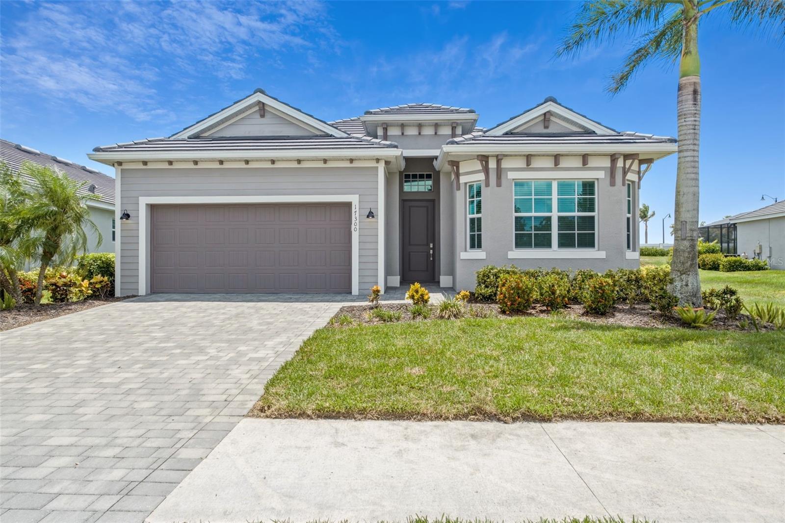 RARE GOLF-DEEDED OPPORTUNITY: GOLF MEMBERSHIP INCLUDED! Experience refined resort-style living in the prestigious Wellen Park Golf & Country Club! This exceptional Angelina floor plan showcases elegant design and the effortless indoor-outdoor lifestyle that defines Southwest Florida living. From the moment you enter, you're welcomed by an expansive open-concept layout filled with natural light. The gourmet kitchen features quartz countertops, 42 inch shaker style cabinets, stainless appliances, closet pantry, and an inviting flow into the spacious living and dining areas—ideal for both intimate gatherings and grand entertaining. There is a versatile flex space adjacent to the living room that is perfect for a guest room, library, or private office. A light-filled guest bedroom is thoughtfully positioned toward the front of the home, while the private primary suite is on the opposite side, offering a tranquil retreat. The expansive primary suite features dual sinks, a soaker tub, a separate shower, and a private water closet. Sliding glass doors open directly to the pool deck, while dual closets and generous proportions provide ample space for a king-sized bedroom suite. Step outside to your own private outdoor oasis, where a heated saltwater pool & spa are surrounded by an expansive paver deck designed for effortless entertaining and year-round enjoyment. Whether hosting sunset gatherings, enjoying morning coffee, or unwinding after a day on the course, this exceptional outdoor living space embodies the Florida luxury lifestyle. In addition, an easement located along the right side of the property enhances the sense of openness and separation from neighboring homes, offering a more spacious and private setting. For peace of mind during storm season, this home has hurricane rated windows and doors! Located in an X flood zone so no need for flood insurance. The HOA fee is just $735.50 per quarter and the master association fee is $1363 per quarter. Residents enjoy an unparalleled collection of world-class amenities, including a gorgeous resort-style pool, vibrant tiki bar and restaurant, full-service spa, sauna, state-of-the-art fitness center, tennis and pickleball courts, and beautifully maintained gated grounds that embody the essence of resort living. The CDD fee is only $2570 per year and is already included in the taxes listed for this property. What truly sets this residence apart is its rare golf-deeded status, conveying two full golf memberships to the championship golf course at Wellen Park Golf & Country Club. Located just a golf cart ride from Downtown Wellen with its premier shopping, dining, entertainment, Sunday Farmer’s Market, and CoolToday Park (Braves Spring Training Stadium). Also nearby is Venice Island with its pristine Gulf beaches, Sharky’s and Fins waterfront dining, Sharky’s fishing pier, and the historic district with its many dining options, boutique shops, Venice Theatre, splash pad, parks/playgrounds, Saturday Farmer’s Market, and tons of events!
