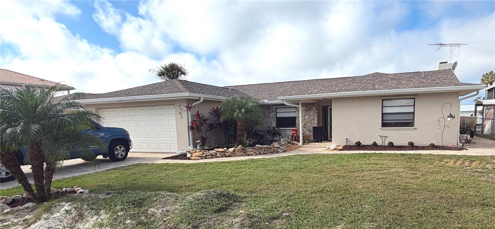 Fantastic opportunity awaits in this meticulously renovated waterfront home with an incredible 70 feet of waterfront with 3 empty lots across the canal from your home making the views more incredible. This very desired split ranch 3 bedroom, 2 bath open floor plan home is situated on a deep-water canal with access to the Gulf. A beautiful water feature at the front entrance will welcome you and your guests home in spectacular fashion. The home features plank style ceramic tile flooring throughout the spacious and open floorplan.  Driveway and walkways are all done in pavers. Garage floor, patio floor and sea wall have all been covered with epoxy coating.   Spend a relaxing afternoon or watch the sunset from your home’s incredible outdoor entertaining space featuring a floating dock and the largest fixed dock in the neighborhood featuring two 10,000lb boat lifts.  More than enough room to bring all your water toys. Multiple sliding doors allow for easy access to the outdoor entertaining space and beautiful views of the canal.  Access, is direct and moments away from the deep water of the Gulf of Mexico.