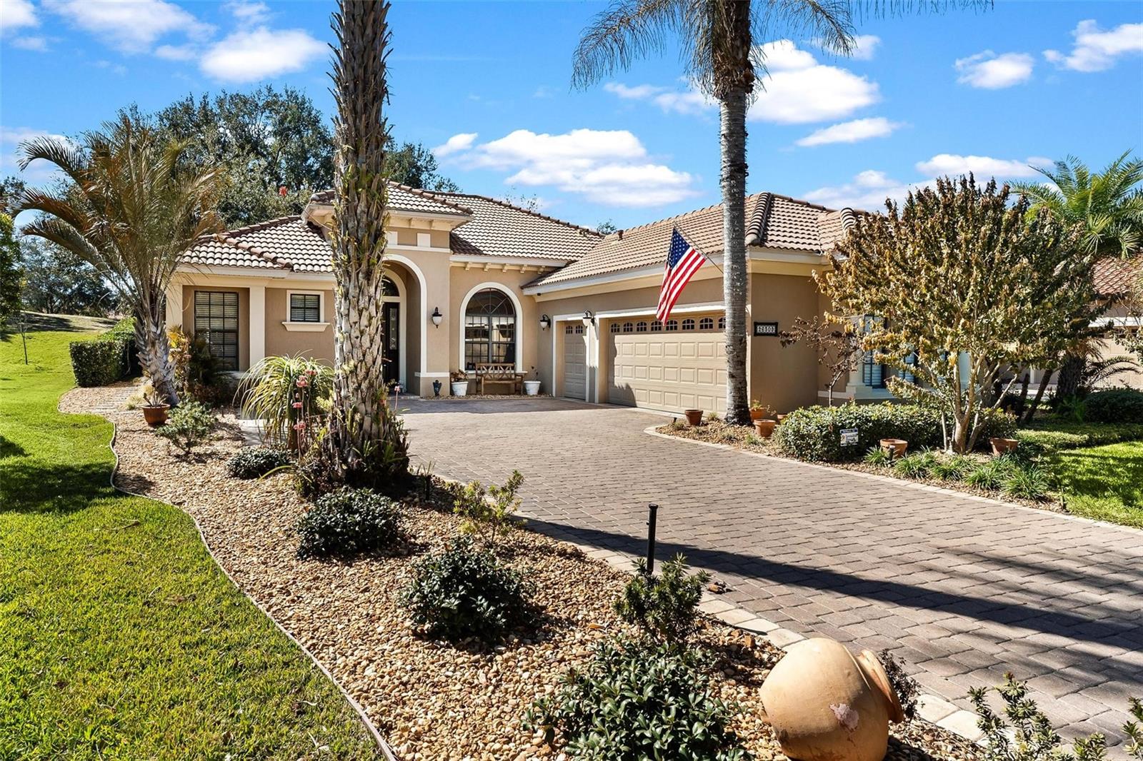 RESORT STYLE LIVING EVERYDAY! Golf Frontage-Gorgeous Home with SOLAR POWER! Attention Buyers...benefit from the seller installing solar valued at $26,000 to home in year 2022! Electric bill averages approx. 45 per month!! This Spanish Mediterranean home boasts magnificent curb appeal and fantastic golf course views of the 8th Fairway in the highly desirable Las Colinas community of Mission Inn Resort. From the moment you arrive, the lush landscaping, tile roof, paver driveway, and striking 8-foot mahogany entry door set the tone for the refinement found within. Inside, impressive porcelain tile flows seamlessly through the main living areas. The formal living and dining rooms are beautifully accented by Roman columns and a tray ceiling, offering a stylish hint of formality while maintaining an open, welcoming feel. Popular in design, home features a kitchen with separate breakfast area opening to family room combo! Guest bath completely remodeled in year 2024!! Convenient inside Laundry Room, too. With 2138 square feet of living area, this 3-bedroom, 2-bath home with a 2 CAR PLUS GOLF CART GARAGE—provides both comfort and functionality, perfectly positioned to enjoy privacy with serene golf course views. The home has been thoughtfully maintained and updated for peace of mind, a HVAC system replaced in 2017 and serviced annually (most recently October 2025), and a water heater from 2017. A whole-house water softener and filtration system was installed by the previous owner, and major appliances have been updated, including the refrigerator and dishwasher (2018), Maytag washer and dryer (2019), and garbage disposal (2019). Combining timeless architecture, modern updates, and a premier golf course setting, this home offers an exceptional lifestyle opportunity in one of Mission Inn Resort’s most sought-after communities. Enjoy 2-18 Hole Championship Golf Courses, Restaurants, Spa, Fitness, Pool, Tennis and more... Minutes to the shopping and Turnpike for quick access to Airport and Orlando! GREAT LOCATION!!