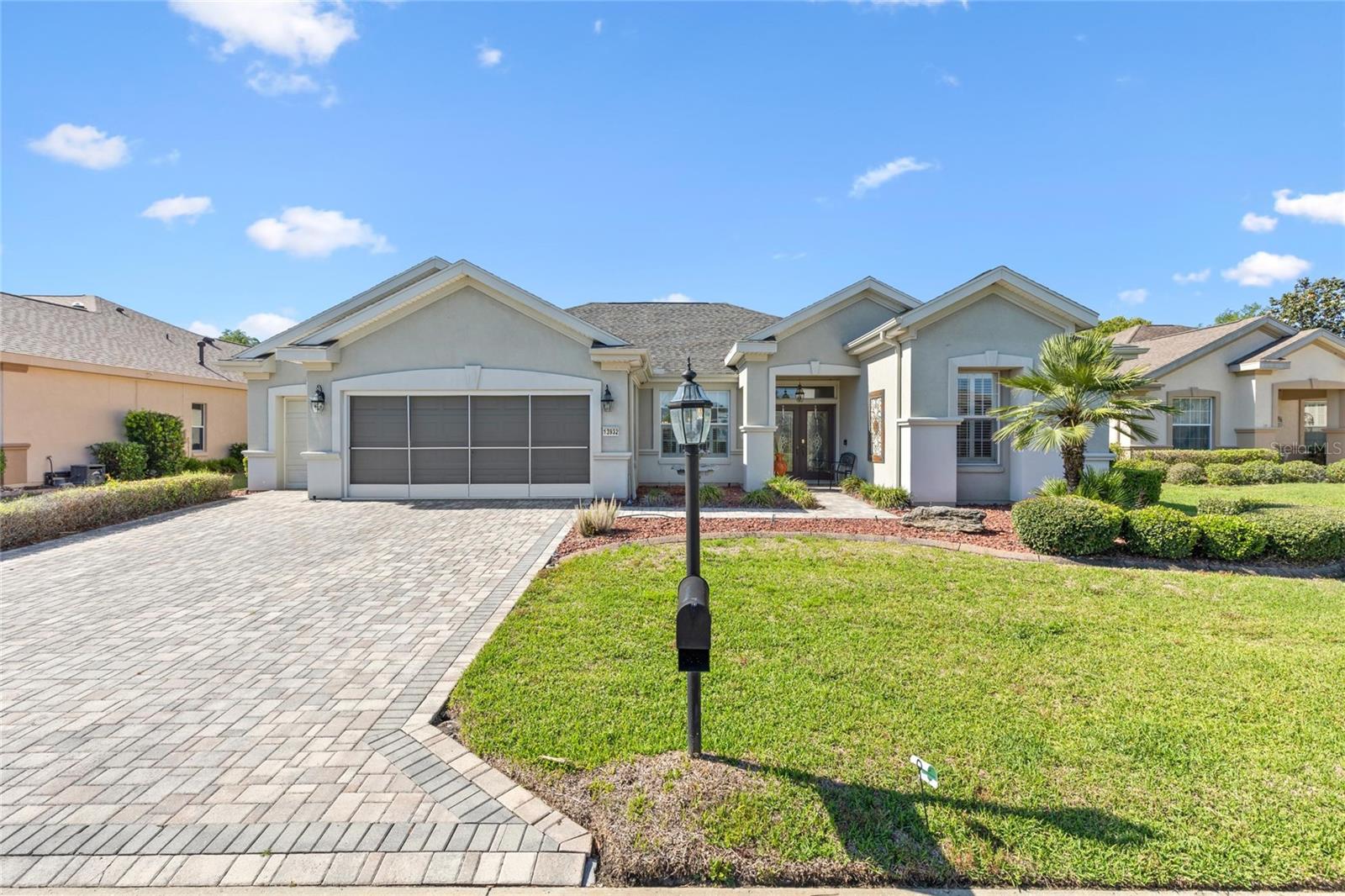 Find your permanent paradise at this beautiful "turn key" home in the sunshine state! (Some furniture in the pictures have been removed and will not stay with the home) You even get your own gas golf cart! Located in Del Webb's Spruce Creek Golf and Country Club, an exclusive 55+ community minutes from The Villages, Florida. Here you will find fabulous amenities and the resort-lifestyle you've been dreaming of! This 3/2 (split plan) open concept home is perfect for your everyday lounging by the pool or hosting fabulous cocktail parties! The private 14x21 heated, screened enclosed SALT WATER POOL has a water fall, new pool pump and a fabulous mural screen on the back wall. From the moment you walk in, you feel the warmth and the heart of what a home should be. The high ceilings, crown molding and plantation shutters add so much character to the home. Some of the bonus features include a brand new ice maker, kitchen reverse osmosis water system, and a tankless water heater. Primary bedroom features a Trey ceiling, walk-in closet and an ensuite primary bath complete with deep soaking tub and separate shower. You will also enjoy Faux marble countertops and shower surround. Double sinks are also an added feature in this stunning bathroom! Have guests? No problem. There are 2 extra bedrooms on the far side of the home. Guests will enjoy their own bedroom with a shared bathroom. Come check this beauty out before it's gone! Sellers are very motivated. All offers will be entertained!