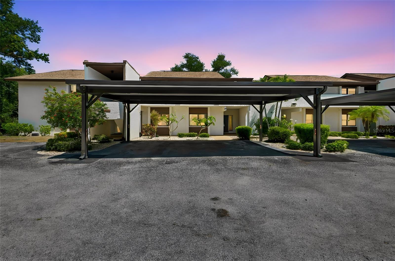 GROUND FLOOR 2 bedrooms, 2 bathrooms, TURN-KEY FURNISHED with golf course views in Timber Creek. Timber Creek is a 55+ community in West Bradenton near Gulf beaches that offers executive 9 hole/par 3 golf course, heated swimming pool, tennis, pickleball courts, community center, walking path in a well maintained mature landscaped setting.  Make this your full time or seasonal retreat. An open, split bedroom floor plan with over 1,200 sq. ft. of living space. An entry foyer with closet opens into a large combination living/dining area with sliders from this area, the kitchen and primary bedroom welcoming beautiful views of the golf course from the huge 22x17 enclosed lanai with an additional enclosed garden area. A nice size kitchen provides good space for preparing meals and entertaining. The primary is 18x12 sq. ft. with walk in closet and walk in shower.  The 2nd bedroom has built in Murphy bed, bath/shower combo, nice size closet with ease of access to 2nd bathroom. This floor plan offers seamless transitions between the interior and exterior for comfortable living and relaxation.