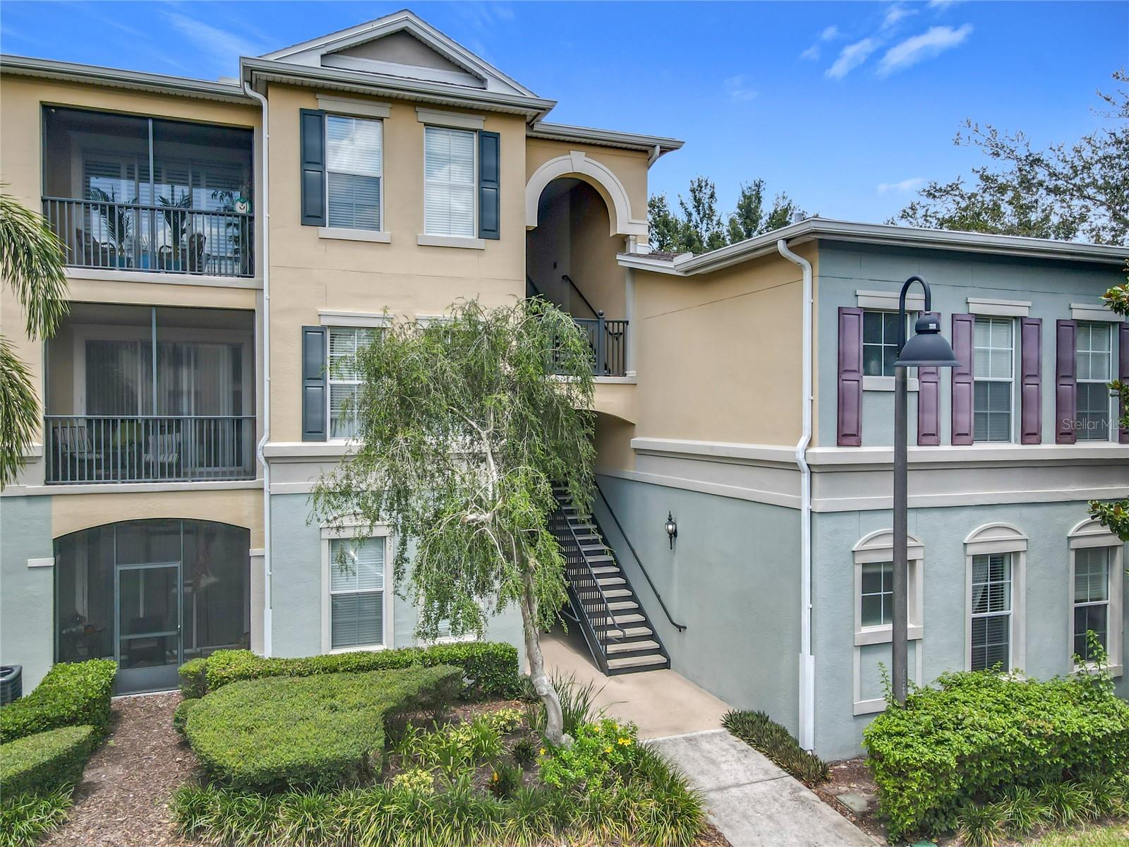 investment property with a very high rental demand for its location and comfort or a vacation retreat, this condo is perfect for you. Beautiful condo located in Lakeside at Lakes of Windermere, corner unit on the first floor (ground floor) with covered lanai  Welcome to this stunning condo located in one of the best and most exclusive areas of Orlando Fl such as Windermere, with 3 bedrooms and 2 bathrooms, this condo which is in perfect condition of care and maintenance, offers a spacious and open layout that perfectly combines the kitchen, dining and living areas, ideal for both everyday life and entertaining. The master suite, located to one side for privacy, has a generous bathroom with a garden-style tub/shower and a large walk-in closet. The kitchen is beautifully equipped with wood cabinets. On the opposite side, you will find the secondary bedrooms along with the second bathroom, a convenient laundry closet and ample storage space throughout. The gated resort-style community includes a clubhouse, pool, fitness room, walkways, green areas, parks, sports areas, on-site management and valet trash service, ensuring convenience and comfort. Located in the heart of Windermere in a strategic location just minutes from Walt Disney World and Downtown Winter Garden, easy access to major streets and highways that bring you closer to other important areas of the city and other local attractions such as Universal Studios, it is close to Publix, shops, restaurants and stores.