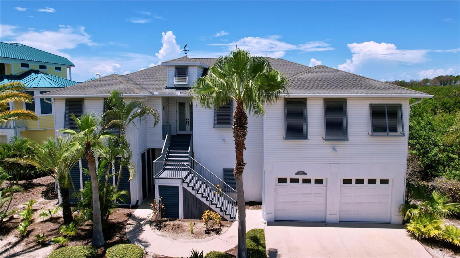 NOW is your opportunity to own this masterfully designed architectural custom built home on the Gulf of Mexico in beautiful Tarpon Spring, Florida. The home features 90 feet of open water views, park like grounds, low maintenance landscaping, wrap around screened enclosed porch and total privacy. Its like being on vacation every day!! Gulf front property on a quiet cul-de-sac, bordering Fred Howard Park with close access to both Clearwater and Tampa. If you dream about year-round vacation lifestyle, this is your best option, providing both privacy and a dream location between two sandy beaches, Fred Howard Park Beach and Sunset beach. This custom designed property takes full advantage of the unobstructed panoramic open Gulf views, spectacular sizzling sunsets, all amenities of Fred Howard Park, proximity to Three Rooker Island, Anclote Key Preserve State Park, Honeymoon Island State Park and waters of St. Joseph Sound. Fabulous open floor plan with walls of high impact glass that bring the outside in with unsurpassed views of the lush tropical back yard, pool, sunsets and Gulf. Elevator access at ground floor entry. Immaculate in every way, this custom home enjoys a bamboo entryway, high 10 ft ceilings, tray ceilings, ceiling fans, plant shelves, Bamboo floors, crown molding in every room, plantation shutters, central vacuum, security system, solar shades, 36ft covered deck with glass see through railings. Elevator! Island kitchen, custom architecture, granite countertops. The home has so many amenities to simplify daily life. Monogram 6-burner gas oven, monogram professional vent hood, built-in Sharp Insight Pro microwave drawer, Bosch dishwasher, reverse osmosis system. Opulent Gulf front master-suite with adjoining office/sitting room, walk-in closet. Master bath w/whirlpool jet tub & walk-in shower. Top of the line salt water pool, solar heated with back up heat pump for cooler weather, descent waterfalls, therapy jets, benches & pop up automatic cleaning system. All new pumps and filter installed in October 2024. Sun & shade areas are abundant, deck for laying out by the pool, brick pavers, tropical landscaping, Gazebo. Dock! One-of-a-kind waterfront 91' x 170' lot. Construction amenities include 2x6 walls, screened first and second floors patios, first floor patio/pool restroom, 50 year roof, elevated platform mounted AC units (2-2018), newer water heater (2021), lighting rod system, built to 2002 Florida Statewide hurricane building code, built 3ft above FEMA codes, Bahama shutters on the east wall and motorized and manual hurricane shutters on south, west and north walls, oversize garage & pool with high elevation. **Home did not flood during past 2 hurricanes.