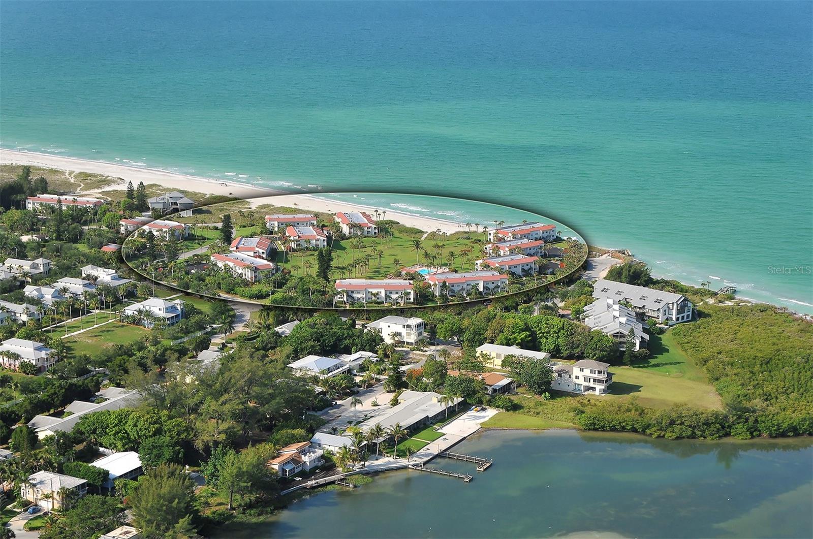 Never miss another beach day or a green flash sunset in this rarely available 2 bed 2 bath home in the Longbeach Community- a GULF FRONT enclave on the tip of Longboat Key.  A short walk to the beach, thoughtfully remodeled and move-in ready, this residence offers spectacular daily views of the Gulf, pool, and lush tropical landscaping- best enjoyed on the 200 sqft screened terrace where there’s plenty of room for reading, relaxing or toasting the sunset and dining. This lovely residence has been loved and meticulously upgraded with superior materials and workmanship. The gourmet kitchen features a spacious central cooking island with Electrolux 6-burner cooktop and hood, brushed stainless GE Monogram and Bosch appliances including a stacked double oven, as well as granite countertops, and solid light cherry cabinets. A breakfast bar, wine rack and built-in office complement this kitchen with added functionality. Additional luxury finishes include raised ceilings, crown molding, hidden surround-sound speakers, and spa-inspired bathrooms with custom mosaic-tile showers, Kohler fixtures, and rain showerheads. The Longbeach Community offers 9.2 acres of Gulffront beach homes just a 5-min walk to the exclusive amenities like private beach access to the quartz-white sand of Longboat Key's beaches, a heated pool, private tennis, and ample parking. In addition to idyllic award-winning beaches, Longboat Key living means exquisite waterfront dining, boutique shopping in St Armands Circle, and unparalleled golf courses and tennis courts. The Longboat Key lifestyle awaits you to create new everlasting memories here in paradise!