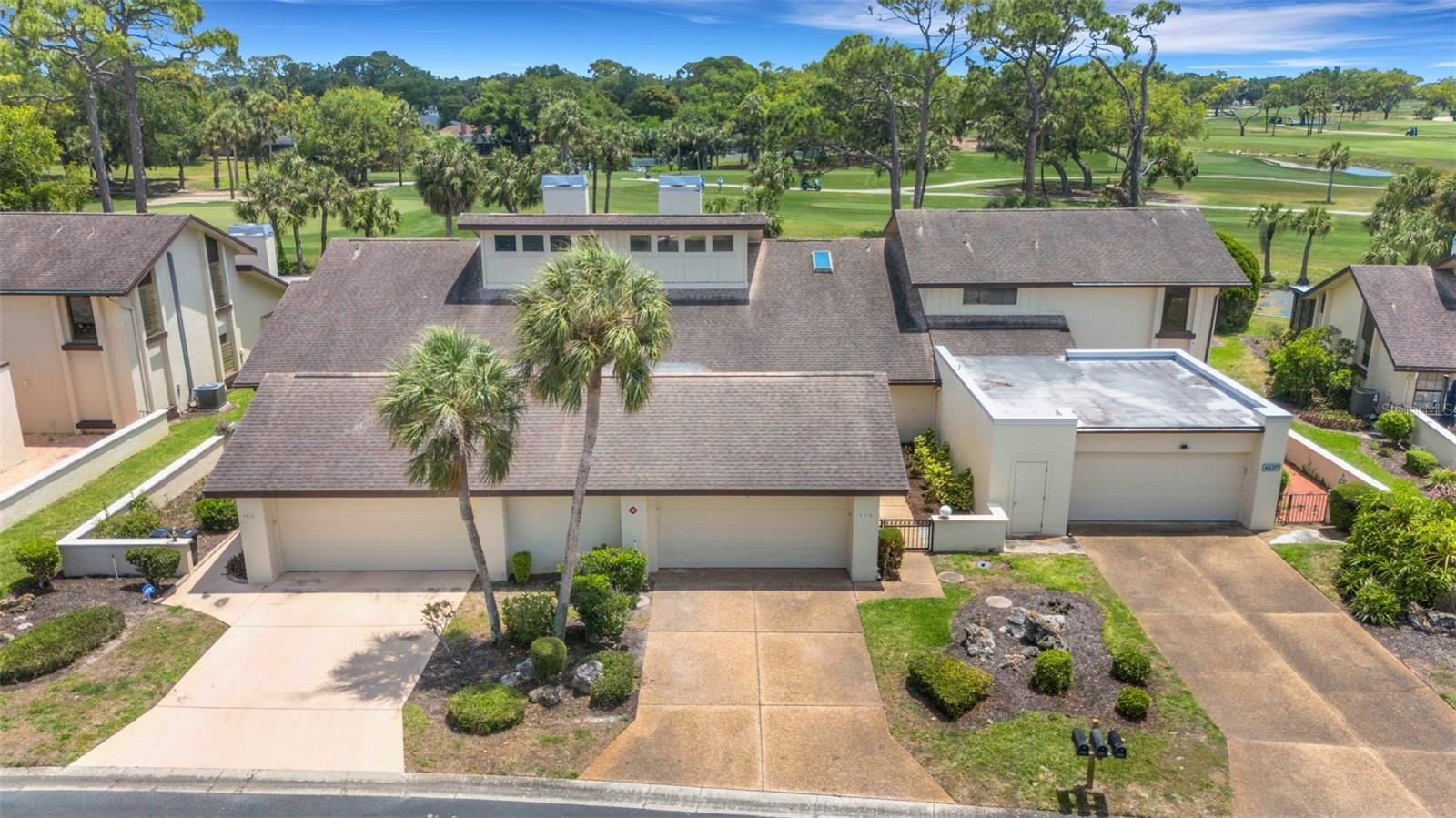 One or more photo(s) has been virtually staged. Tucked within a small, quiet enclave, this 3 bedroom, 2 bath villa offers comfort, flexibility, and a great location on the IMG Academy Golf Club Course, though there is no mandatory membership. Vaulted ceilings and a statement double sided wood burning fireplace add character and a touch of drama to the main living areas, while also creating a natural separation between the living and dining spaces. Updates include newer kitchen cabinetry, quartz countertops, brand new high quality luxury vinyl plank flooring, brand new plush carpet, and fresh interior paint throughout. Finished in neutral tones, the home offers a versatile canvas ready to suit a variety of styles. A gated front courtyard area creates a private approach to the home. The spacious primary suite includes ample closet space with built in features and an ensuite bath. The second and third bedrooms share a hall bath, with the third bedroom offering two entrances, including French doors off the foyer, making it ideal for an office or flex space. Just inside the garage, a versatile nook and adjoining area off the kitchen offers flexible use as a casual dining space, small office, hobby area, or drop zone. Multiple sliding glass doors open to a screened patio overlooking the golf course and a peaceful pond. Residents can also enjoy access to two community pools within the neighborhood. Located in a quiet enclave yet close to IMG Academy, State College of Florida, the beaches, and Sarasota-Bradenton International Airport. A balance of peaceful surroundings and everyday convenience.