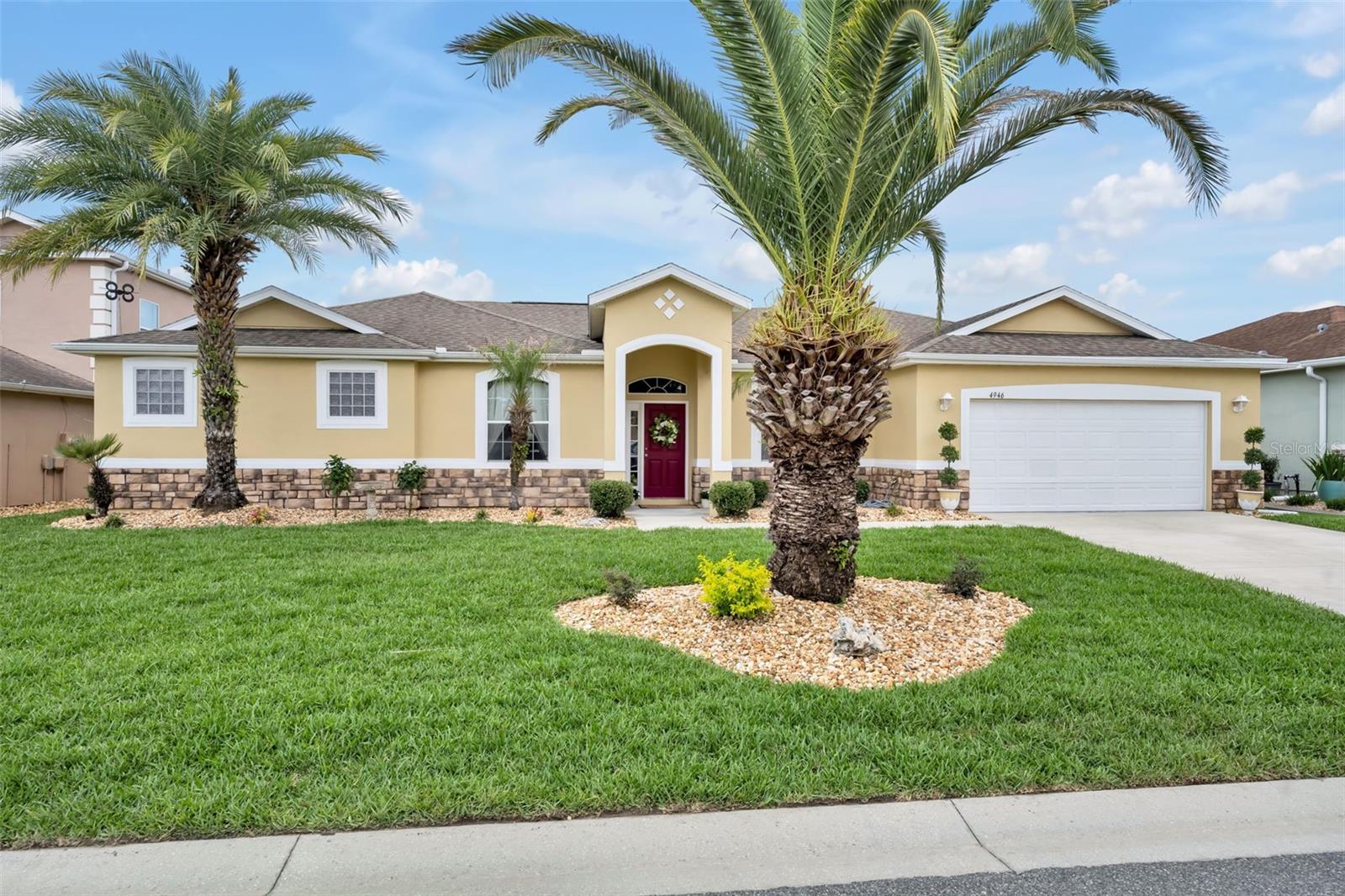 RARE opportunity in the gated Parkwood community! Situated on a premium OVERSIZED DOUBLE LOT with no backyard neighbors, this beautifully maintained 2,547 sq ft home offers the perfect blend of privacy, space, and modern upgrades. Featuring 3 bedrooms, 3 full bathrooms, plus a versatile flex room ideal for a home office, nursery, or potential 4th bedroom, this thoughtfully designed triple-split floor plan provides both functionality and privacy. Best of all, this sought-after community has NO age restrictions and NO bond, making it a rare find in the area.

The heart of the home is the upgraded chef’s kitchen with granite countertops, custom backsplash, oversized island, expanded pantry, Bosch dishwasher, and Samsung smart refrigerator, all flowing seamlessly into spacious living and dining areas designed for entertaining. Multiple floor-to-ceiling glass sliders create exceptional indoor-outdoor living, opening to the lanai and expansive backyard retreat.

The luxurious primary suite is a true escape with tray ceilings, spa-inspired bath featuring a garden soaking tub, zero-entry shower, dual vanities, and custom closet storage. Additional upgrades include updated flooring, fresh interior paint, upgraded lighting, custom window treatments, built-in closets, brand new landscaping and sod, architectural stone exterior, Ring doorbell camera, and transferable termite bond.

Located in one of the area's most desirable gated communities, residents enjoy resort-style amenities including a resort-style pool, fitness center, clubhouse, tennis courts, basketball courts, playground, and park access. The home is also conveniently located just minutes from shopping, dining, entertainment, and the highly sought-after A-rated Villages Charter School.

Move-in ready, meticulously maintained, and truly one-of-a-kind—schedule your private showing today
