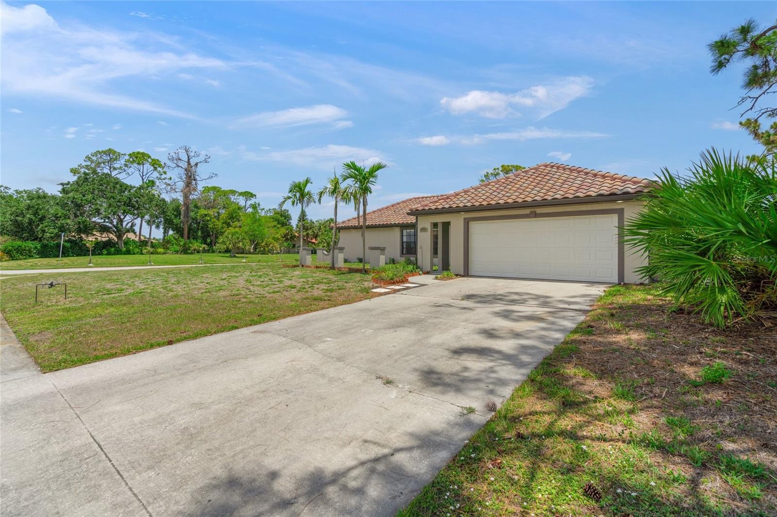 Exceptional location just minutes from the new Sarasota Memorial Hospital currently under construction on Sumter Blvd. This beautifully renovated home is situated on an oversized 0.54-acre lot and offers the convenience of city water and sewer. Extensive updates include a newer barrel tile roof (2023), newer stainless steel KitchenAid appliances, granite kitchen countertops, updated cabinetry, lighting, flooring, plumbing, bathrooms, upgraded electrical, fresh interior paint, and new interior doors. Ideally located near Gulf beaches, shopping and dining along U.S. 41, and the Atlanta Braves Spring Training stadium. Enjoy close proximity to Warm Mineral Springs Park and the North Port Aquatic Center. Not located in a flood zone and no CDD fees.