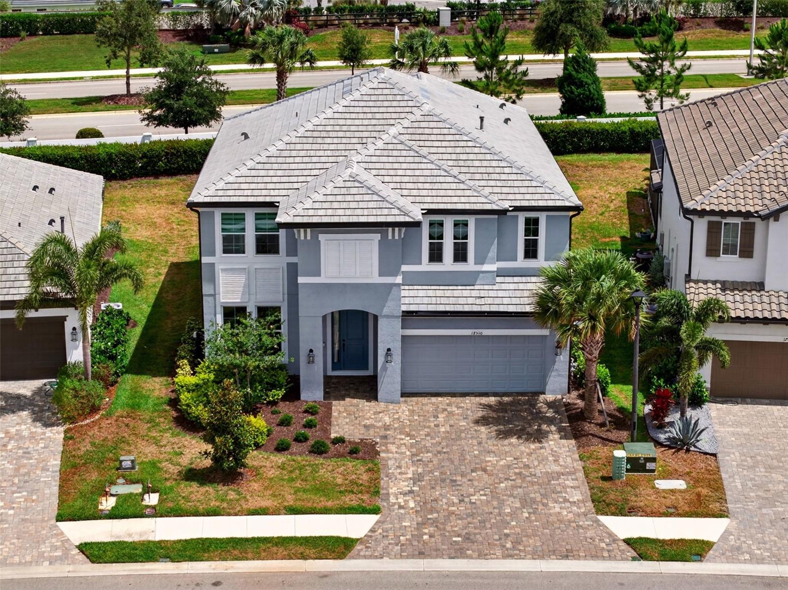 Welcome to this exceptional Lakewood Ranch home offering the perfect blend of luxury, flexibility, and multigenerational living. Located in the highly sought-after community of Sweetwater, this beautifully upgraded residence features a rare and highly desirable dual primary suite layout — with one luxurious owner’s suite conveniently located on the main floor and a second private primary suite upstairs, ideal for guests, extended family, or growing households.

The downstairs primary retreat is thoughtfully designed with private access directly to the covered lanai, creating the perfect setup for in-laws, long-term guests, or anyone seeking added privacy and convenience. Wake up and step right outside to enjoy peaceful mornings in your private outdoor living space.

Built for both style and peace of mind, the home features impact windows throughout along with custom upgrades and designer touches that elevate every room. From the moment you enter, you’ll notice the attention to detail, open-concept design, abundant natural light, and high-end finishes throughout the home.

The chef’s kitchen flows seamlessly into the spacious living and dining areas, making entertaining effortless. Upstairs, the additional primary suite provides its own private sanctuary along with generous secondary bedrooms and flexible living space perfect for a media room, office, or play area.

Enjoy Florida living at its finest with a covered lanai ideal for relaxing or entertaining year-round. Situated in one of Lakewood Ranch’s premier communities, residents enjoy access to top-rated schools, resort-style amenities, shopping, dining, golf, and world-class Gulf Coast beaches just a short drive away.

This rare floor plan with dual primary suites, impact windows, and extensive custom upgrades offers the versatility and luxury today’s buyers are searching for — don’t miss the opportunity to make it yours!