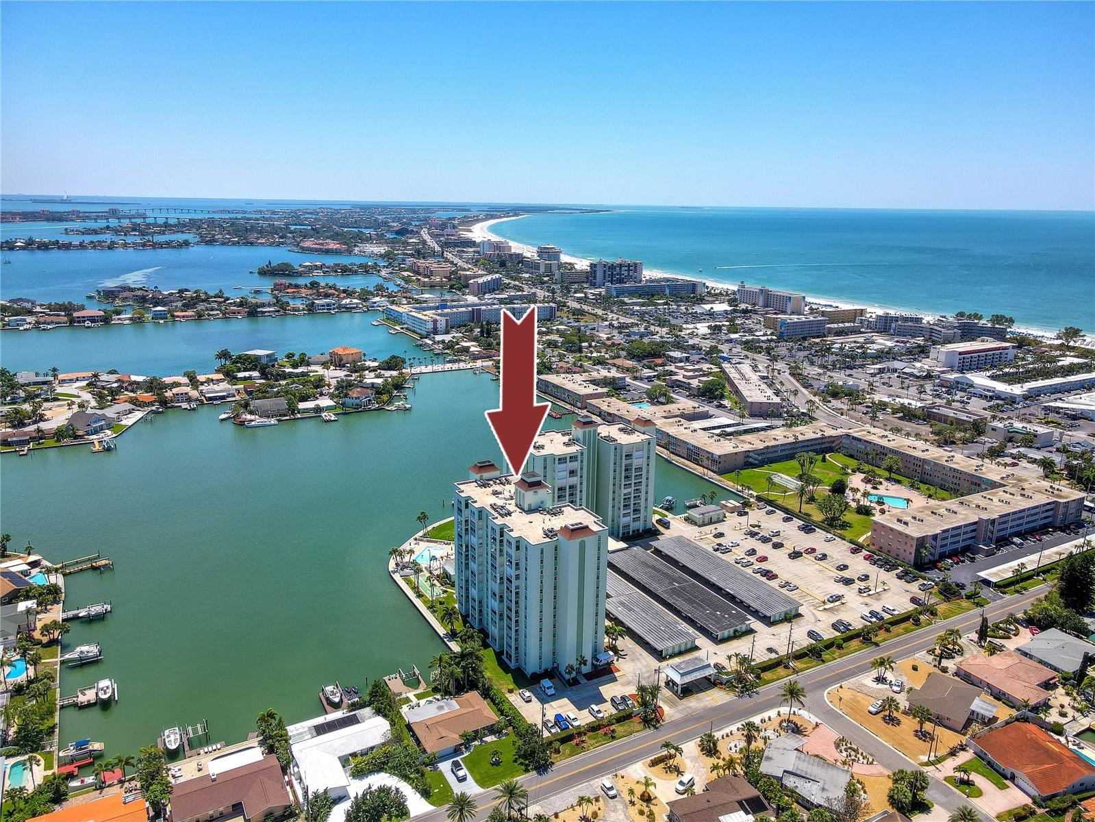 Rarely available Penthouse with Gulf front views, offering peaceful seclusion along the Gulf of Mexico combined with easy beach access, resort style amenities and endless entertainment to enjoy. This 1,973 sqft corner unit has a desirable clean open floor plan that includes a bright living room/dining room combo complete with vaulted ceilings, engineered hardwood flooring, hurricane impact sliders and an oversized covered balcony. The spacious kitchen layout is ideal for entertaining guests and offers plenty of sitting, counter and cabinet space, solid stone surfaces, wood cabinets and SS appliances. Down the hall is a luxurious prime suite with sitting area, big walk-in closet, dual sinks, tub and separate walk-in shower. The additional suite is equipped with a large walk-in closet, private bath, built in desk and stunning water views. More bonus features include inside washer/dryer in unit, assigned covered carport and storage closet. Live in luxury with an expansive outdoor activity area with a Gulf front heated swimming pool, sauna, private fishing pier, Clubhouse, fitness center and many more fun features to explore. This fantastic location places you a short distance from upscale restaurants, local shopping, major highways plus a quick commute to Tampa International Airport.