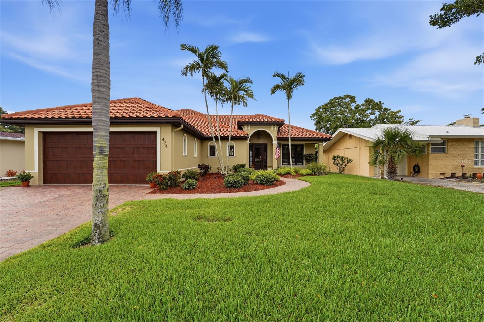 ISLAND OF VENICE! Location, Location, Location  This lovely home is located across the street from beautiful West Blalock Park.  Designer Coviello and Associates worked with Hutchinson Construction to complete this masterpiece in late December 2013.  Pride of ownership shows as the original owners have provided exceptionally care. Impressive entry, soaring ceilings and indoor and outdoor living blend seamlessly. For the culinary inclined, the kitchen has just been redone. This kitchen was designed for hosting, celebrating, or just lingering.  The refrigerator, microwave oven, traditional oven, dishwasher, washer and dryer have been replace in March 2026.  The gas cook top, the water heater, outdoor grill and whole house Generac generator are fueled  from a 250 gal propane tank.  The primary bedroom suite is a peaceful retreat and is located on the first floor, as well as the great room and studio. Tip toe from room to room on exquisite bamboo flooring. The second floor has a fabulous private guest room with luxury bath.  The garage is a whapping 852 sq ft., and can accommodate three cars.   The screen lanai is 16 ft X10 ft, and is accessible from the great room and the primary suite. For peace of mind, this Florida home is equipped with impact, tropical wind resistant windows through out.  In the rare event of a hurricane, this home is a fortress.  The windows are designed to withstand hurricane's high winds and the impact of flying objects.  If the power goes out, simply turn on the Whole House Generator and you will be in air conditioned comfort.  You will have all the luxuries of a home with power supplied by Florida Power and Light.  Now, there is no need to worry! The library, events at the community center, The triangle Inn, Old Betsy (1925 firetruck) and the arts center are just steps away. Charm, comfort, and convenience awaits you in this fabulous Venice home. Walking trails, bike trails, festivals, art fairs, local theater, the beach, boating and dining are all easy to reach.  Come on down to the Island of Venice.  We can't wait to met you.