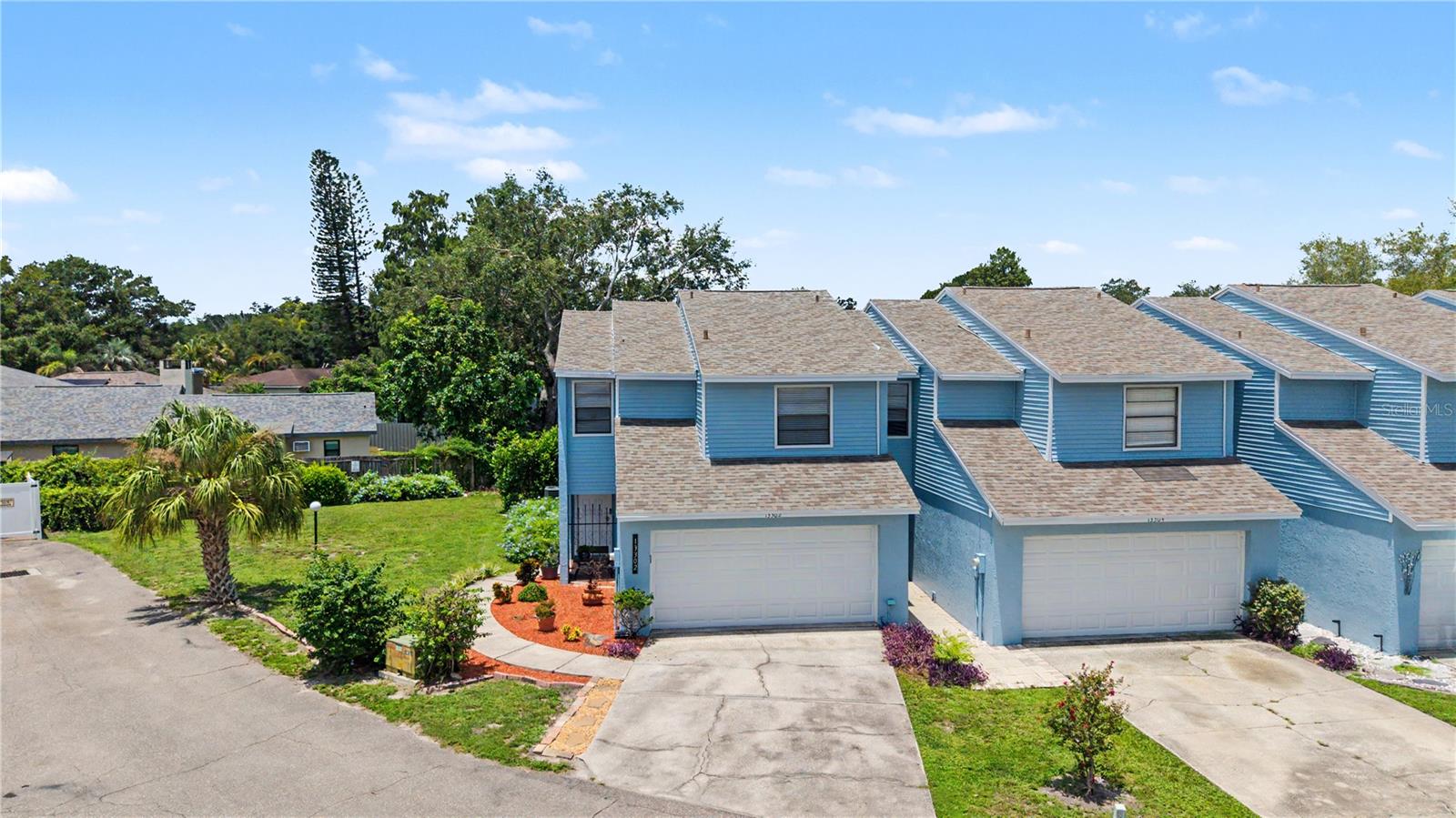 Beautifully updated townhouse style condo in the Carrollwood/Forest Hills area. This property features 3 bedrooms, 2 ½ baths and a 2-car garage. Interior updates were done in 2022 and include granite in the kitchen and all the baths; wood cabinets with under cabinet lighting in the kitchen; stainless steel appliances; washer and dryer convey and are from 2023; water heater December 2021; and HVAC system 2020.  New roof was installed in 2024 and exterior painting completed in 2025 by the condo association. There are high ceilings in the living room along with a fireplace.  French doors take you out to a screened lanai off the kitchen/dining room area with a view of trees and the pond. All 3 bedrooms are upstairs with 2 full baths – one in the primary suite and the 2nd bathroom in the hall conveniently located near the 2 guest bedrooms. One guest room has built-in shelving and is currently being used as a home office. The primary bedroom has a set of French doors out to a private screened in balcony with a view of the pond behind the community. The seller will leave the extra refrigerator in the garage, the washer and dryer, the Google doorbell and the patio furniture. The condo association takes care of the exterior including roof, exterior painting, lawn maintenance, building insurance and sewer, trash and water. This home is located close to shopping, restaurants and more with easy access to I-275 via Fletcher Road. Come see this beautiful home today and make it yours!