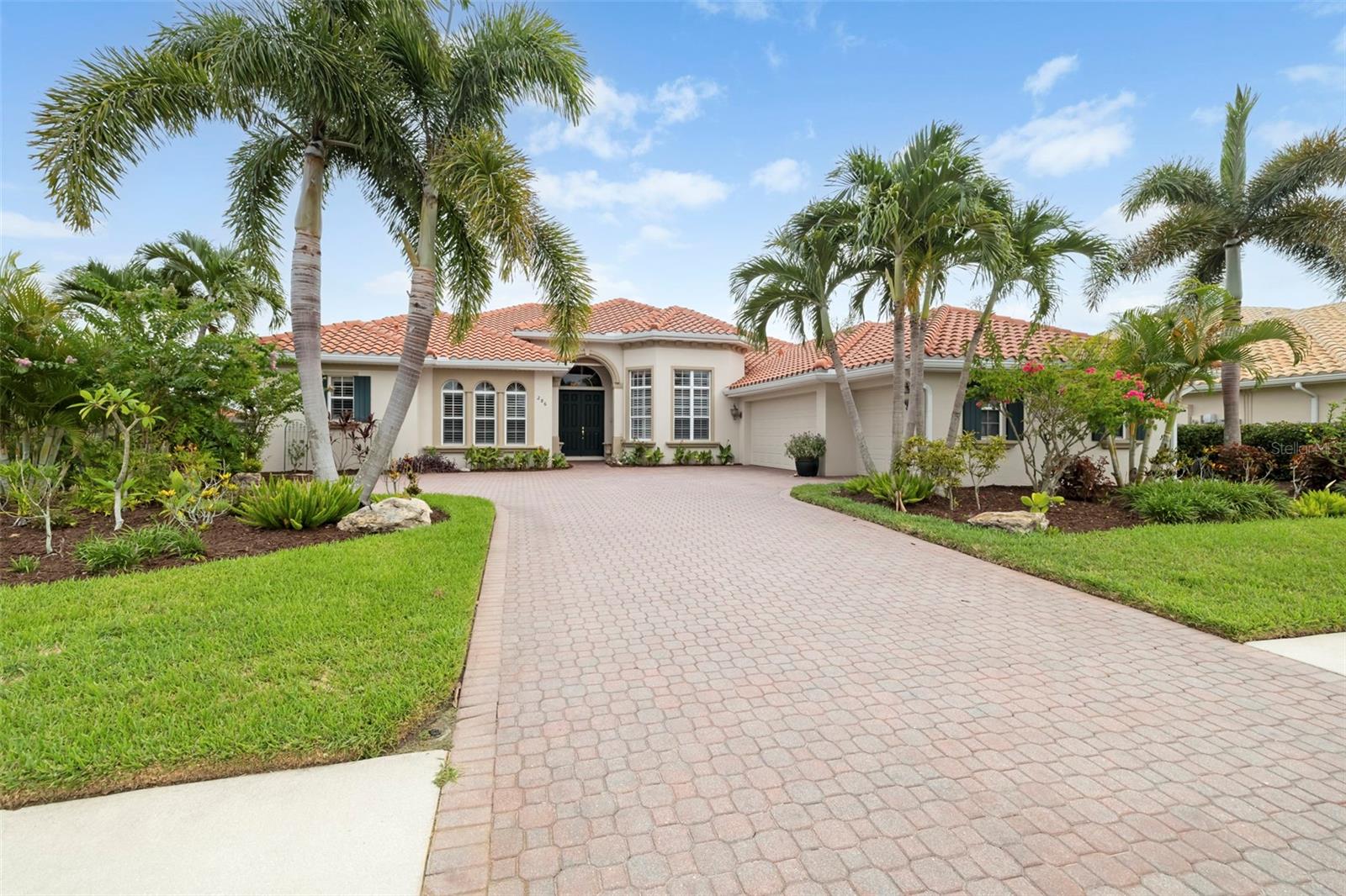 Enjoy long, private lake views and peaceful rising sun mornings from this highly desirable Francesca model in the Venetian Golf & River Club. Loved for its open concept and natural flow, this floor plan features tall ceilings with crown molding, Italian tile in the main living areas, an updated kitchen, and warm natural light that fills the home at daybreak. Impact windows and doors provide year round confidence, complemented by automated Storm Smart hurricane shutters at the front entry and across the entire lanai. A new roof was installed in 2025 for added peace of mind. The split layout offers 3 bedrooms, 3 full baths (including a convenient pool bath), an office/den, and a versatile flex room ideal for fitness, hobbies, or storage. The true dining room includes plantation shutters, and all bedrooms feature carpeting and ceiling fans for comfort. Outdoor living embraces the tranquil lake backdrop, where preserve views on both sides create a sense of privacy and calm. The large infinity edge pool and spa overlook shimmering water and morning wildlife activity, with a newer pump, pop up cleaners, and generous deck space perfect for quiet coffee moments or relaxed entertaining. A 3 car side load garage, oversized paver driveway, and additional parking pad provide excellent convenience and functionality. Located in the gated, amenity rich Venetian Golf & River Club, residents enjoy dining, fitness, tennis, pickleball, nature trails, and optional golf. All of this is just minutes from shopping, multiple beaches, dining, and I 75—an ideal blend of comfort, thoughtful updates, and peaceful lakefront living.
