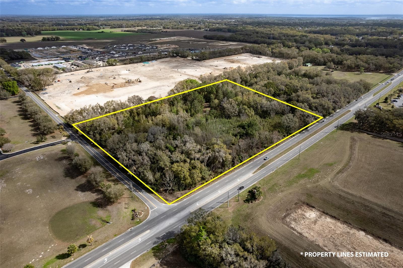 Corner property across from The villages, Sumter Landing, with over 646 feet of frontage on CR 42.  Property at NE Corner of intersection with SE 73rd Ave.     This land is presently zoned A1.  Ideal for church or nursery or senior living  with special use , or re-zone for commercial or multi family, or residential use.   Could have a large nice family house(s) on this site.  Please consider visiting or driving by this property and see the possilitites for your vision and purpose ,    Land is 8.89 Acres with 646 feet frontage on CR 42 and 597 Feet Frontage on SE 73rd Avenue estimated subject to survey.   Basicaly squre property.   Area of great growth and multi residential units being built.