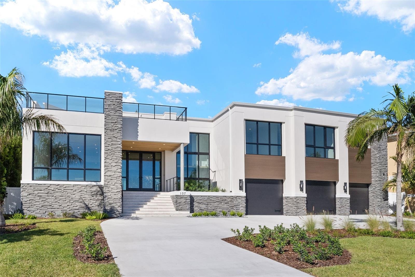 Under Construction. Open Bay views and unseen modern design on Davis Islands. This modern home is built for entertaining and ease of living by Forge Building Co. Enjoy spectacular open Bay views from much of the home with exceptional outdoor living spaces facing front and back. The home features 5 bedrooms, 5 and 2.5 baths, one room is a semi-detached guest suite, and an office, along with two outdoor kitchens: one on the back outdoor living space and one on the rooftop deck. Spectacular modern kitchen with built-in Gaggenau fridge and freezer, Gaggenau cooktop, and three Gaggenau wall ovens. The club room is just off the main living area and is the ultimate entertaining space. It includes a full wet bar, ice maker, and two built-in subzero 146 bottle wine coolers as well as plenty of room for pool table and has a double sided fireplace. The guest retreat off the Lanai offers a semi-connected bedroom for guests or family to enjoy. A second story "roof top oasis" will offer an amazing and unique space to relax or entertain. The 50'x15' pavered deck will include an outdoor kitchen complete with grill and fridge. Just off the roof top oasis, the semi-private Study with sliding glass doors offers a quiet place to relax or get some work done while enjoying endless open bay views. a bedroom completes the area. Spacious Master bedroom and bath with stunning views as well as private wet bar, private elevator access, sitting room, and fireplace. Separate Media room with fridges and plenty of space for any buildout you desire. Back porch will include an outdoor kitchen and overlook a beautiful pool and spa. Some of the appointments of the home include an elevator, 4 car tandem garage, impact-resistant window walls, almost all 2 story block construction, quartz and marble countertops thru out, built-out closets, and much more! Located on beautiful Davis Islands just across from the walking and bike path and just a short distance away from Davis Islands Village with many restaurants, shops, and bars. Bring your golf cart and enjoy the Island lifestyle with walking / biking paths, baseball fields, public tennis courts, public historic pool, two dog parks (one wet and one dry), a beach, public marina, and an airport. Located only minutes from Downtown Tampa, Water Street, Sparkman Wharf, and the Tampa Riverwalk, makes this neighborhood the most desired in South Tampa!