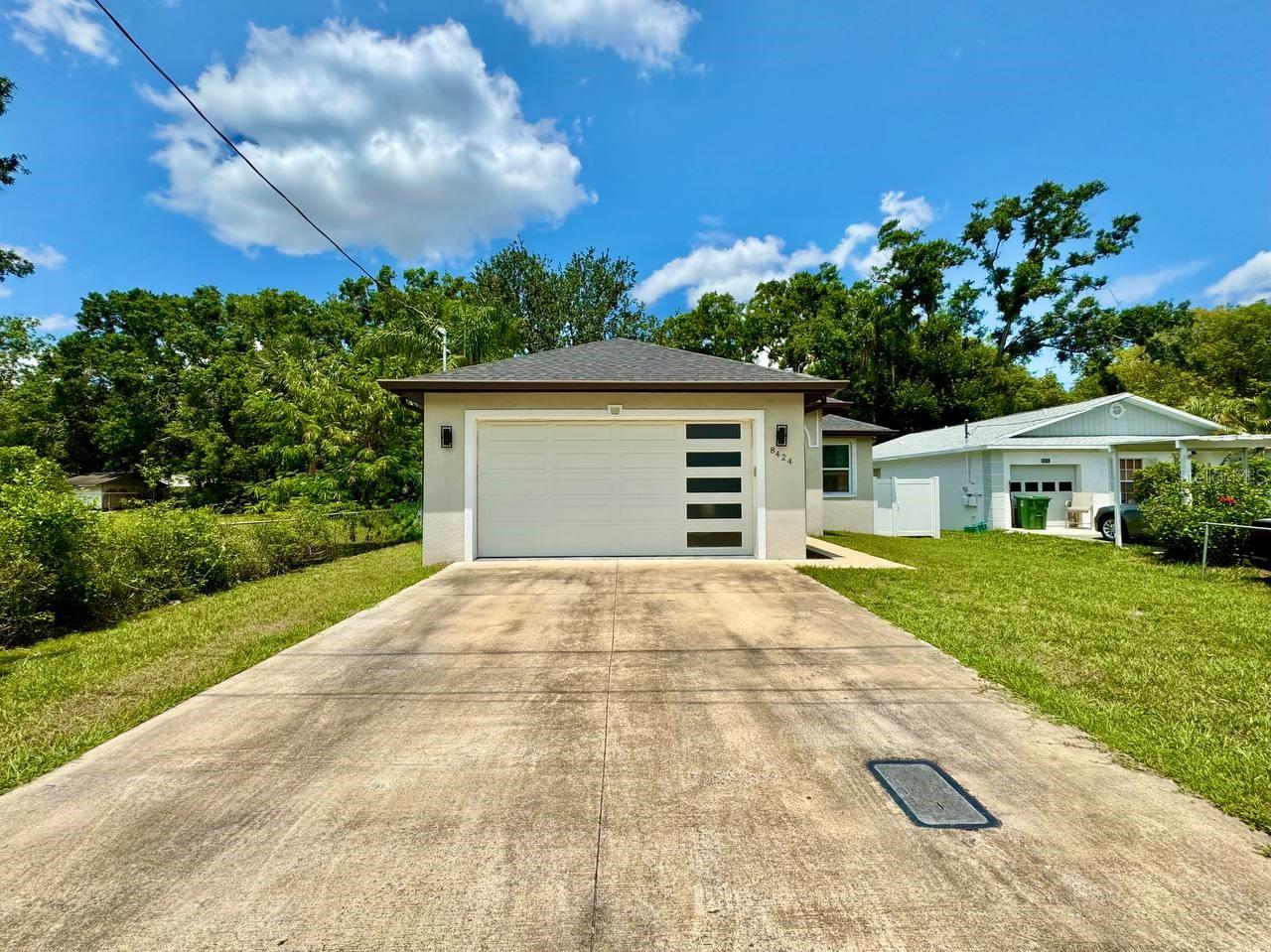Welcome to this beautifully renovated 3-bedroom, 2-bathroom home featuring a 2-car garage and stylish upgrades throughout. With ceramic tile flooring spanning the entire home, this move-in ready gem offers durability and elegance in every room. The open and airy floorplan highlights a chefs dream kitchen, complete with sleek stainless-steel appliances, granite countertops, ample cabinetry for storage, and a layout that's perfect for both everyday living and entertaining. The spacious primary suite is a true retreat, offering a walk-in closet and a luxurious en-suite bathroom with dual sinks and a large walk-in shower. Two additional bedrooms and a fully updated second bath provide flexibility for guests, family, or a home office. Step outside through sliding glass doors to enjoy the Florida lifestyle in the large, fenced-in backyard with a covered patio ideal for entertaining or simply relaxing outdoors. Discover your own private garden paradise, complete with a chicken coop and a lush variety of plants and trees. You'll find an abundance of fruit trees such as papaya, banana, fig, moringa, starfruit, Lula avocado, Barbados cherry, and mulberry. The garden is also rich with herbs and edible plants including lemongrass, basil, thyme, chives, lemon balm, lavender, sage, rosemary, and tomatoes. For those who enjoy a bit of heat and flavor, the yard also features a variety of peppers including jalapeno's, bell peppers, and Aji peppers - creating a vibrant, self-sustaining oasis right in your own backyard. With a spacious two-car garage (featuring a temperature-controlled mini-split system), this home is truly a one-of-a-kind find! Centrally located near Seminole Heights, the Tampa Zoo, a variety of restaurants, entertainment options, and major highways, this home combines convenience with contemporary comfort. Don't miss your chance to own this completely updated, turn-key home in a vibrant Tampa neighborhood! In addition to the advertised base rent, all residents are enrolled in the Resident Benefits Package (RBP) for $50.00/month which includes HVAC air filter delivery, credit building to help boost your credit score with timely rent payments, utility concierge service making utility connection a breeze during your move-in, and much more! More details upon application. Washer and dryer included for your convenience. Pets welcome, 3 max. Occupied and Available 07/26/2026!