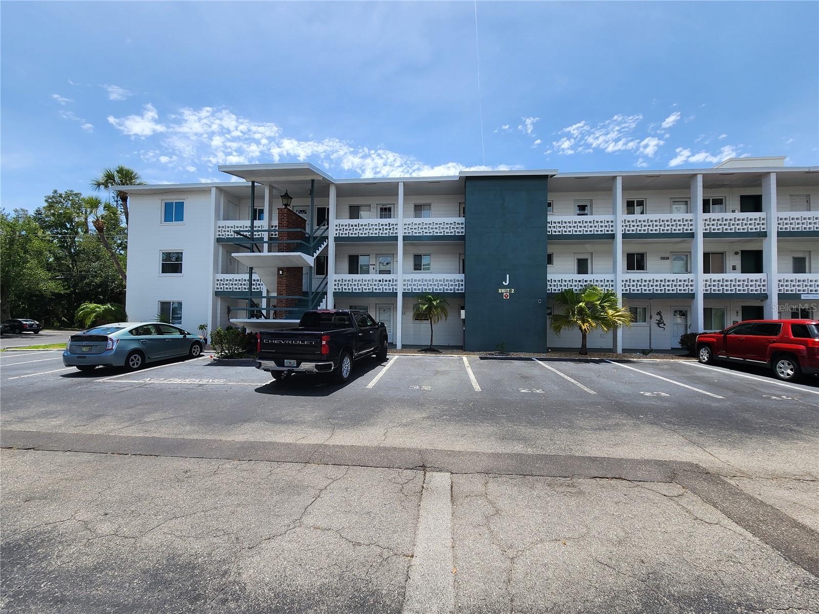 BEST VALUE IN BAYSORE SECOND CONDO – FIRST FLOOR UNIT!  FULL SIZE WASHER AND DRYER!  Stop scrolling—this is the one buyers have been waiting for. Located in a well-maintained 55+ community, this rare first-floor condo means no elevators, no hassle—just park right outside your door and walk in.  This 2-bedroom, 1-bath home is clean, comfortable, and move-in ready, featuring easy-care laminate flooring and a vinyl-enclosed lanai with peaceful, park-like views—your own quiet retreat to relax and unwind.  Hard-to-find extras include a full-size washer & dryer inside the unit and additional storage, giving you the space and convenience.  Step outside and enjoy a true Florida lifestyle with resort-style amenities: a heated pool, active clubhouse, shuffleboard courts, and beautifully maintained grounds that make this community so desirable.  Location is everything—and this one delivers. You can walk to  shopping,  and dining,  minutes to SRQ Airport, public transportation on your street (60th Ave W) , and the library. Plus, you’re a short drive to golf courses and the world-famous beaches of Anna Maria Island.  First-floor convenience        Park at your front door    Washer & dryer in unit     Low-maintenance living     Prime location.  Community rules: 55+, no pets, and must own 1 year prior to renting.  Opportunities like this don’t last—schedule your showing NOW before it’s gone.