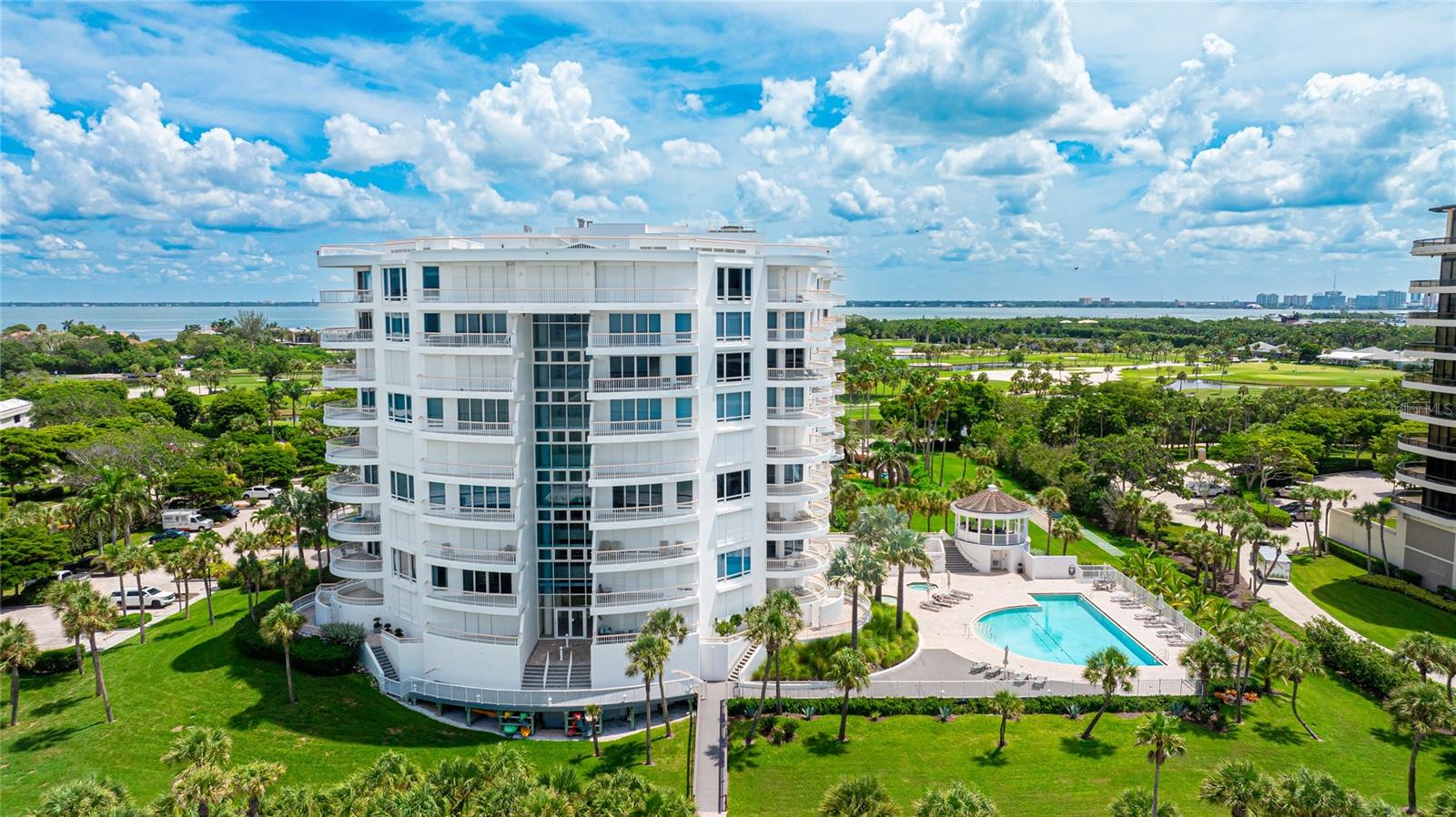 Experience unparalleled coastal living in this luxury condo, nestled behind the gates of the prestigious Longboat Key Club. Offering stunning views of the Gulf of Mexico and Sarasota Bay from every room, this 3-bedroom, 3-bath residence spans 2,410 square feet of refined elegance.The interior has been completely remodeled by Brista Homes to create an open and inviting space, perfect for entertaining. Enjoy porcelain plank floors, custom cabinets, quartz countertops, a French induction range, workstation apron front sink, an electric fireplace, and an art TV that enhances the living area. Each room provides stunning views plus access to one of two spacious balconies, blending indoor comfort with outdoor splendor. Designed in a sophisticated coastal style, this condo features a new water heater, 2 new AC units, full laundry room, a large pantry, and ample storage, including two balcony storage closets and a private building storage locker. Additionally, you'll have a secured parking spot for your convenience. Guests are welcomed with access to three overflow guest suites, available on a first-come, first-served basis. The community amenities include 24 hour concierge services, heated pool, fitness center, two Har-Tru tennis courts, and a private boardwalk that leads to your deeded beach access point. Enhance your lifestyle further by becoming a member of the renowned Longboat Key Club, available for purchase separately, offering exclusive amenities and services. Live the ultimate coastal dream.