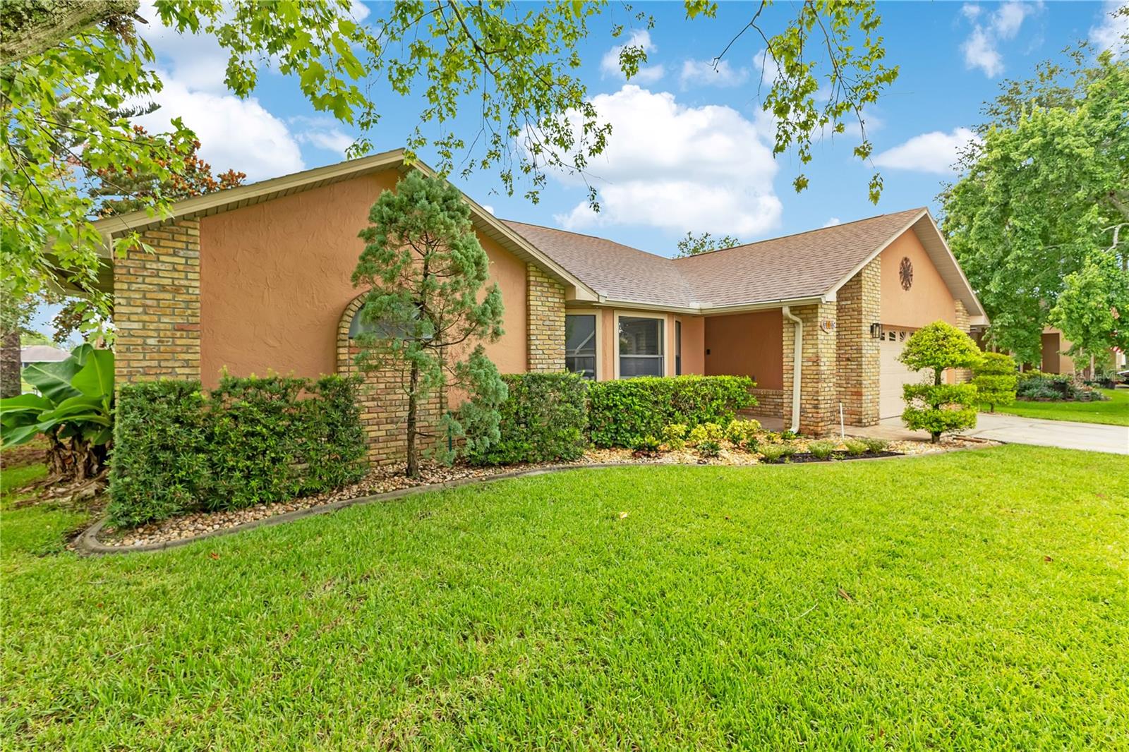 From the moment you turn onto the quaint, canopied streets of SWEETWATER CREEK you'll feel it.  A place to settle in and enjoy for years. Amazing CURB APPEAL greets you with a lush lawn and mature, meticulously maintained landscaping, the kind that only comes from A HOME THAT'S BEEN LOVED.
Inside, tall ceilings, fresh paint, and brand-new flooring create a bright, welcoming feel. The FUNCTIONAL SPLIT FLOORPLAN tucks the private primary suite on its own side of the home, a quiet escape with a separate step-in shower, soaker tub, and dual vanities. Three additional generously sized bedrooms and two full baths are well positioned for family and guests.
Gather with ease across a spacious living room, formal dining room, and versatile flex space for an office, playroom, or den. At the heart of it all is the UPDATED KITCHEN with granite counters and double ovens. The showstopper? A HUGE FLORIDA ROOM and serene WATERVIEW setting, perfect for morning coffee on the patio and peaceful Florida sunsets.
Sweetwater Creek is an established community with a LOW HOA, no CDD fees, and a playground, minutes from St. Cloud's shopping, dining, medical, and Lakefront Park on East Lake Toho, and a couple miles from Florida's Turnpike. You're about 18 miles to Orlando International Airport, 25 minutes to Lake Nona, 45-60 minutes to Walt Disney World and the theme parks, and approx an hour to the Space Coast beaches.
Come see why 2333 Sweetwater Blvd is the one you've been waiting for.